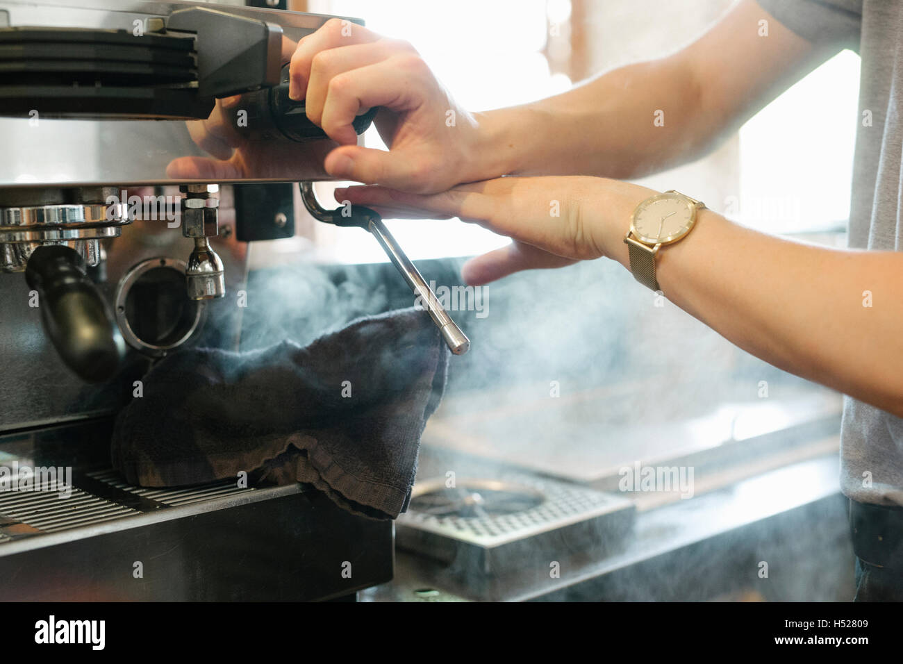 Close up of steam coming out of a commercial espresso machine. Stock Photo