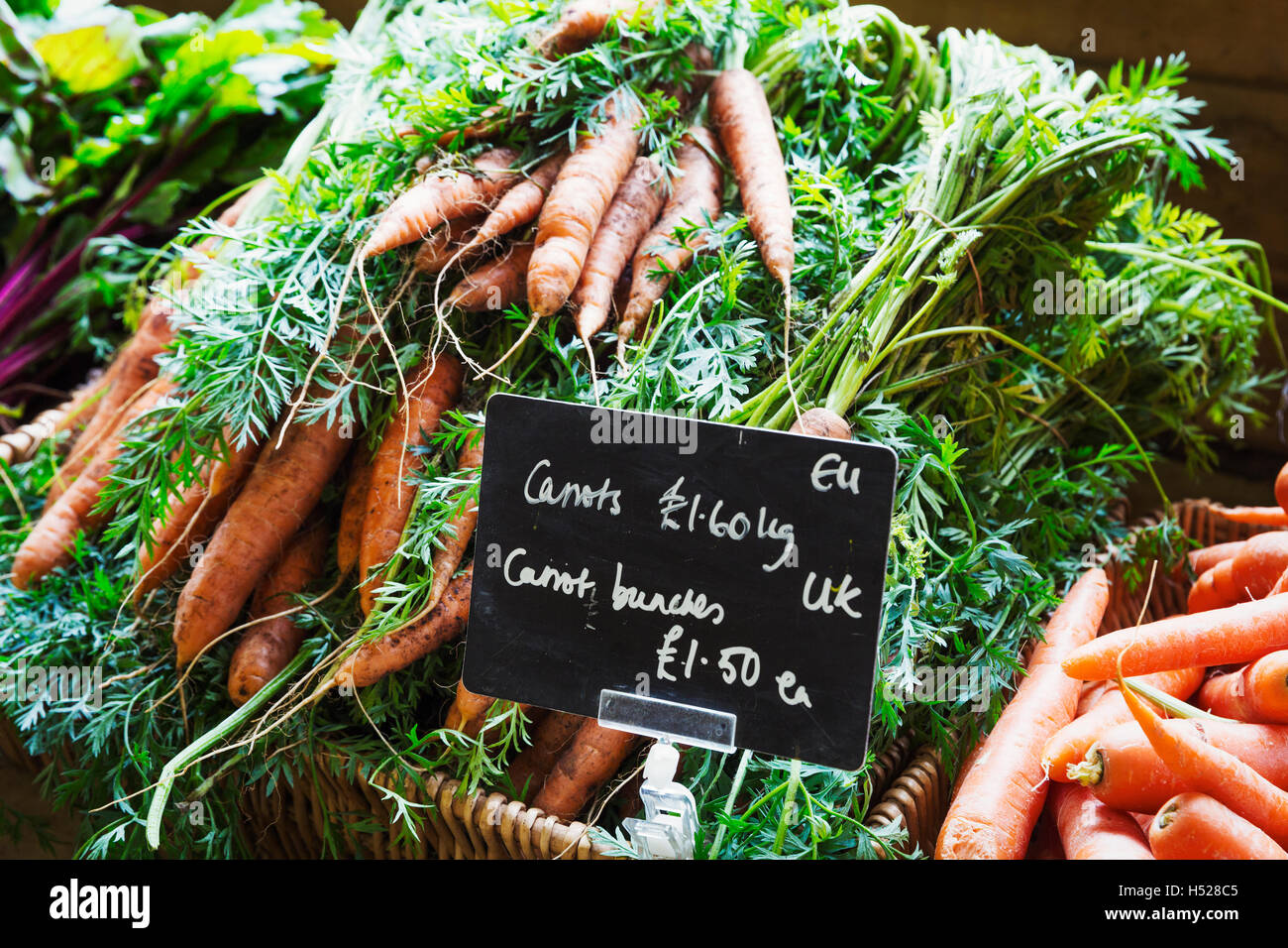 Organic carrots being sold in a farm shop Stock Photo Alamy