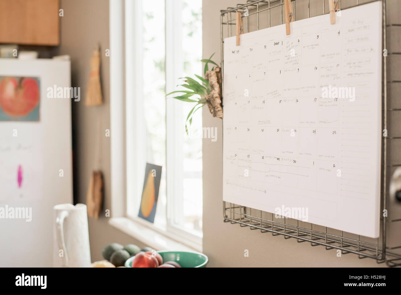Wall planner on a kitchen wall Stock Photo Alamy