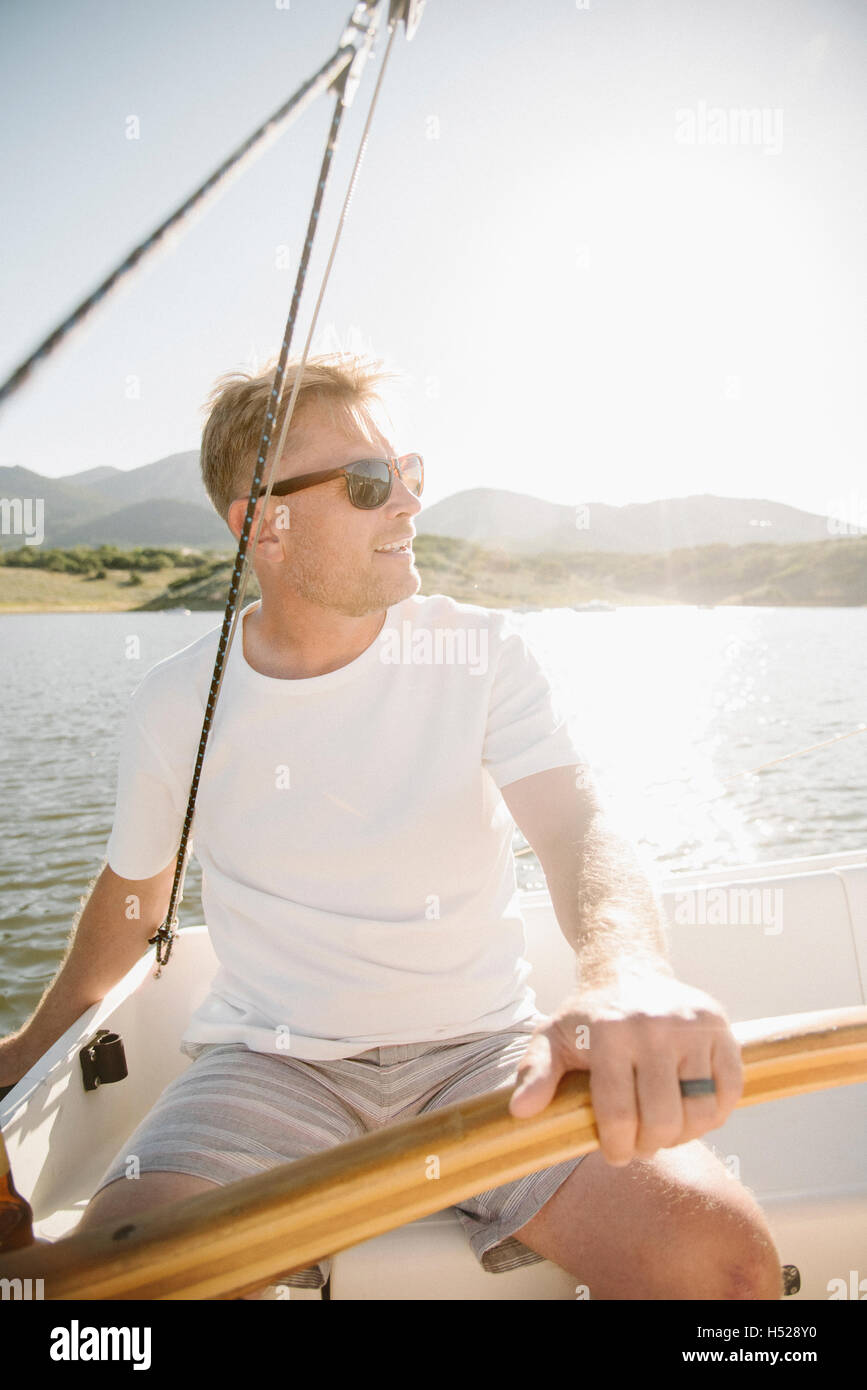 Man steering boat hi-res stock photography and images - Alamy