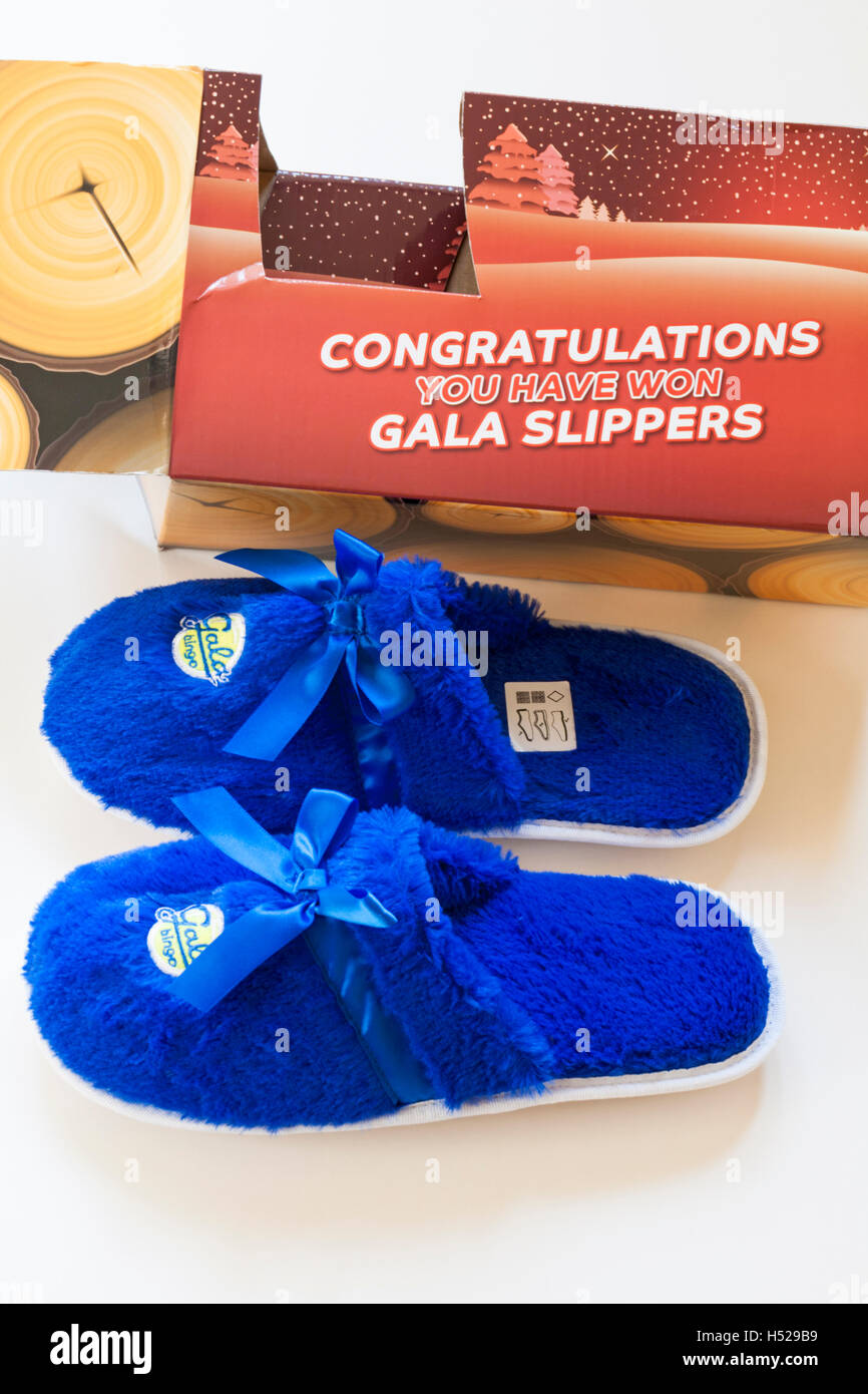 Bingo prize - Congratulations you have won gala slippers set on white background - slippers removed from box Stock Photo