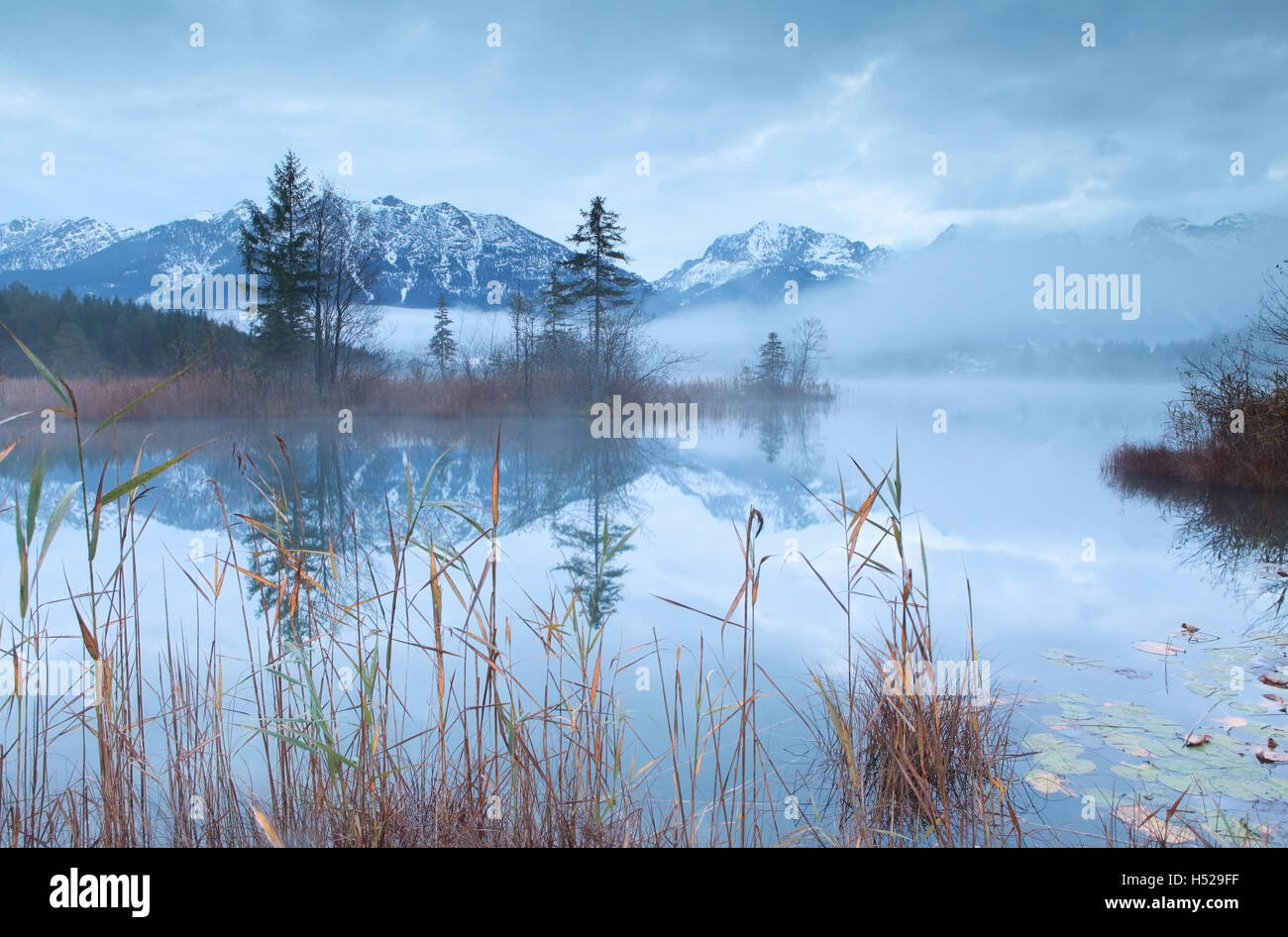 Karwendel mountain range reflected in lake Barmsee Stock Photo