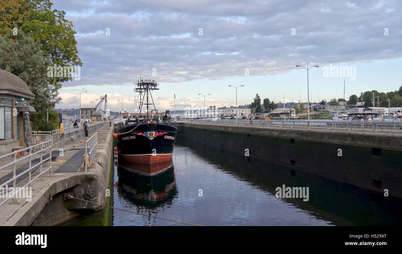 SEATTLE, WASHINGTON STATE, USA - OCTOBER 10, 2014: Hiram M. Chittenden Locks with large commercial fishing vessel docked in a ship canal Stock Photo
