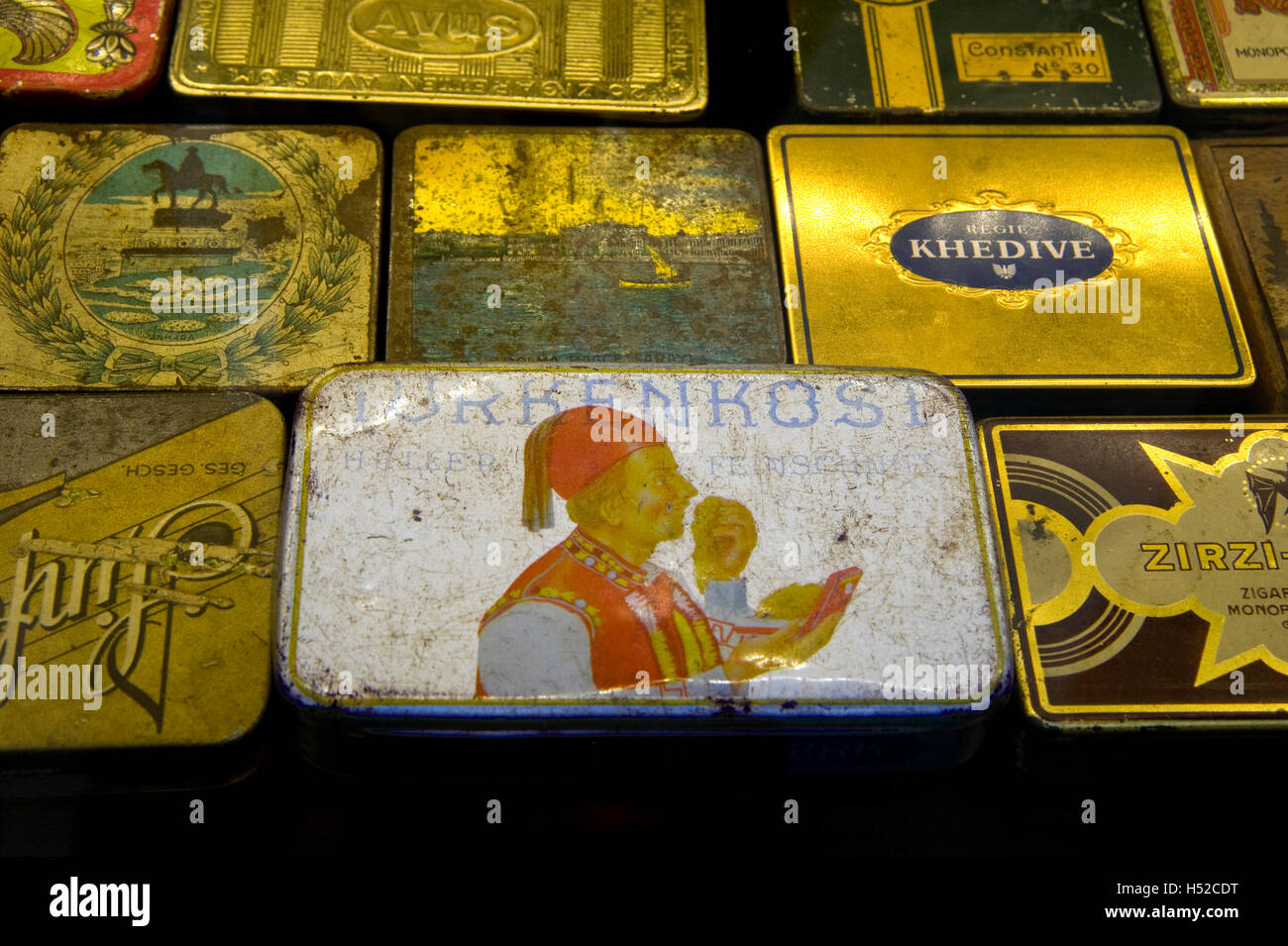 Antique cigarette boxes on display is storefront window in the Taksim