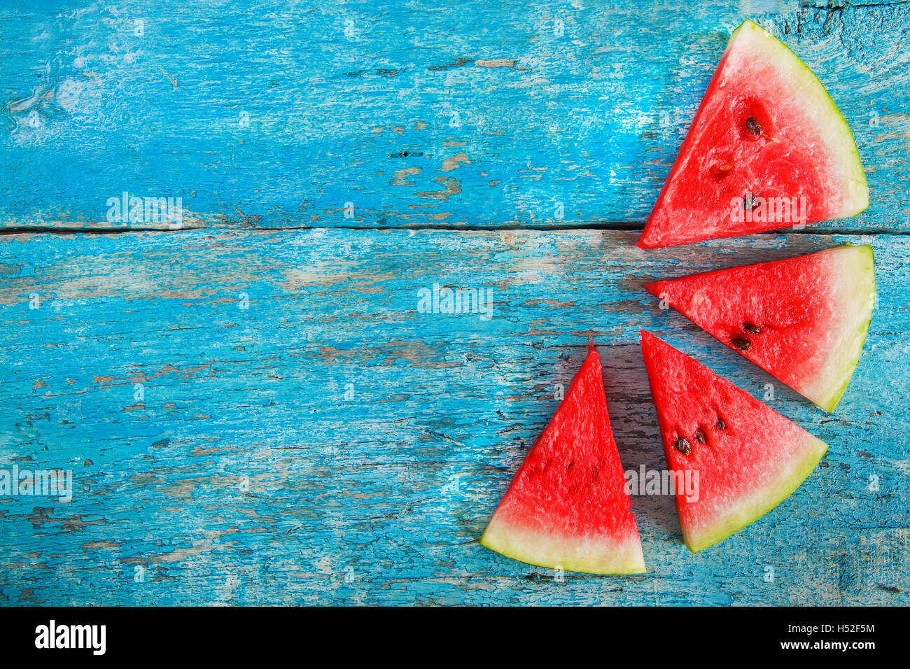 slice of watermelon on a blue background Stock Photo - Alamy
