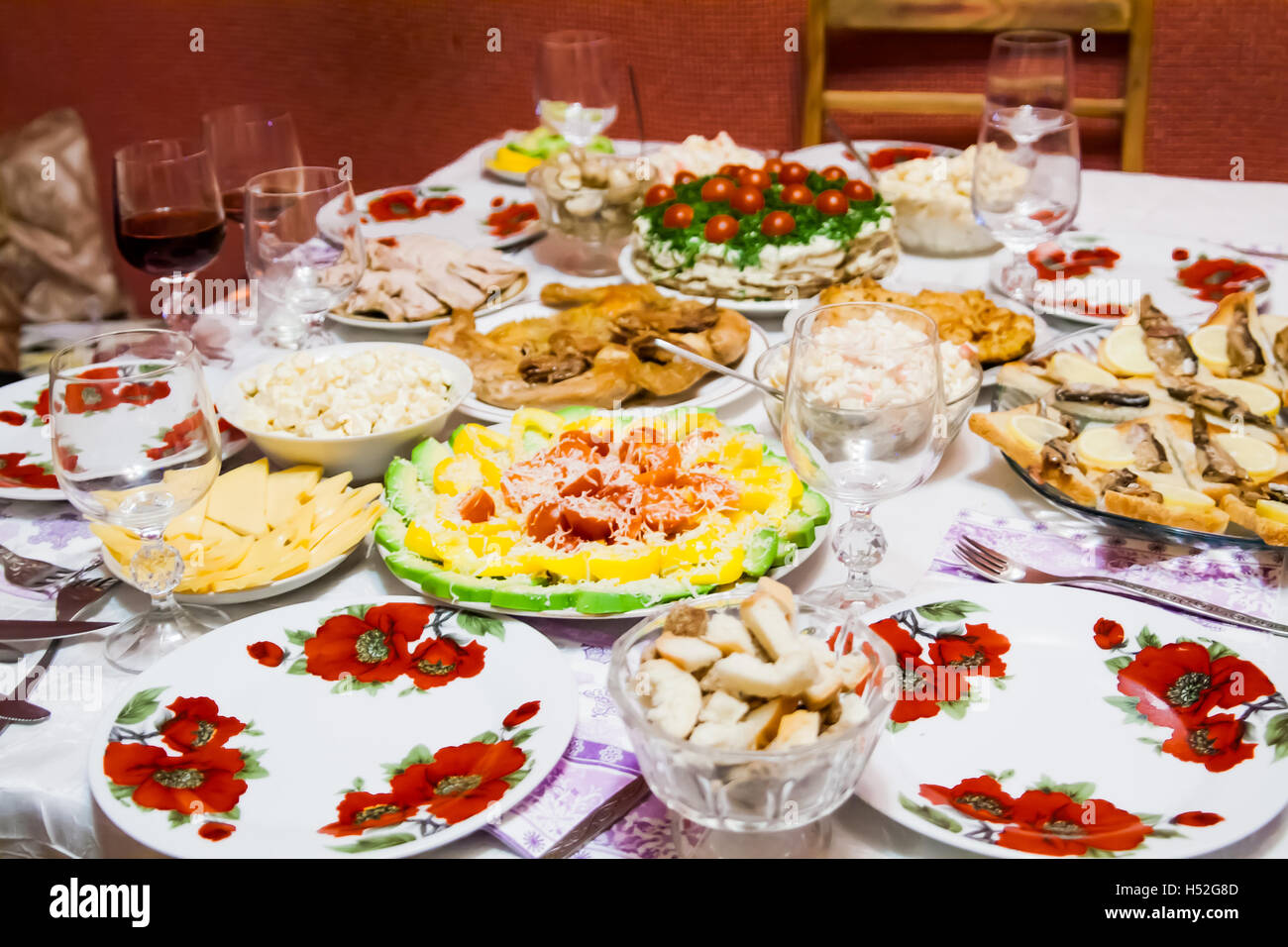 holiday table with dishes, with different dishes, salads. Stock Photo