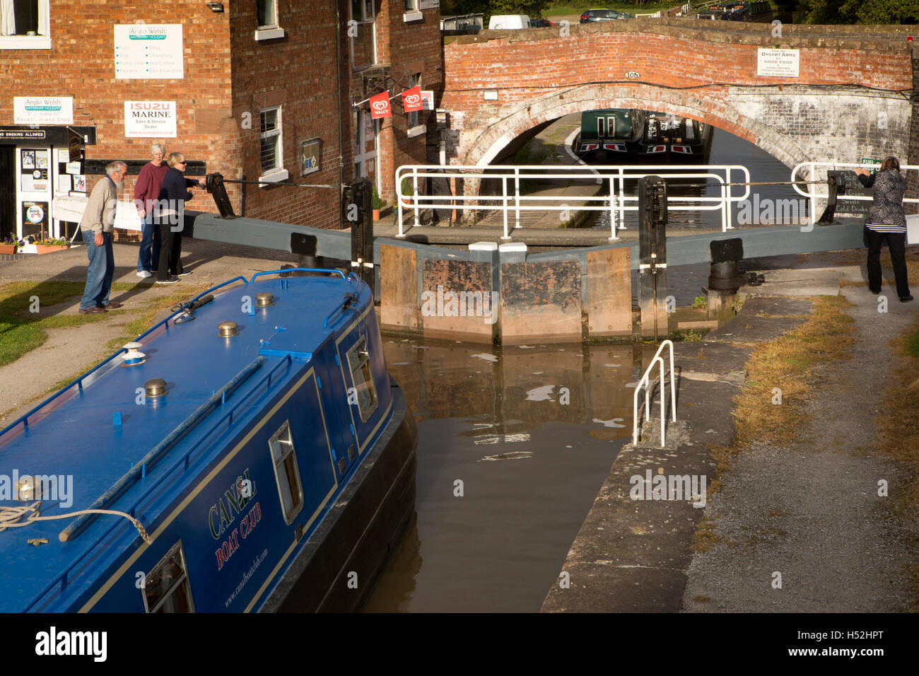 UK, England, Cheshire, Bunbury, narrowboat in ‘staircase’ locks on Shropshire Union Canal Stock Photo