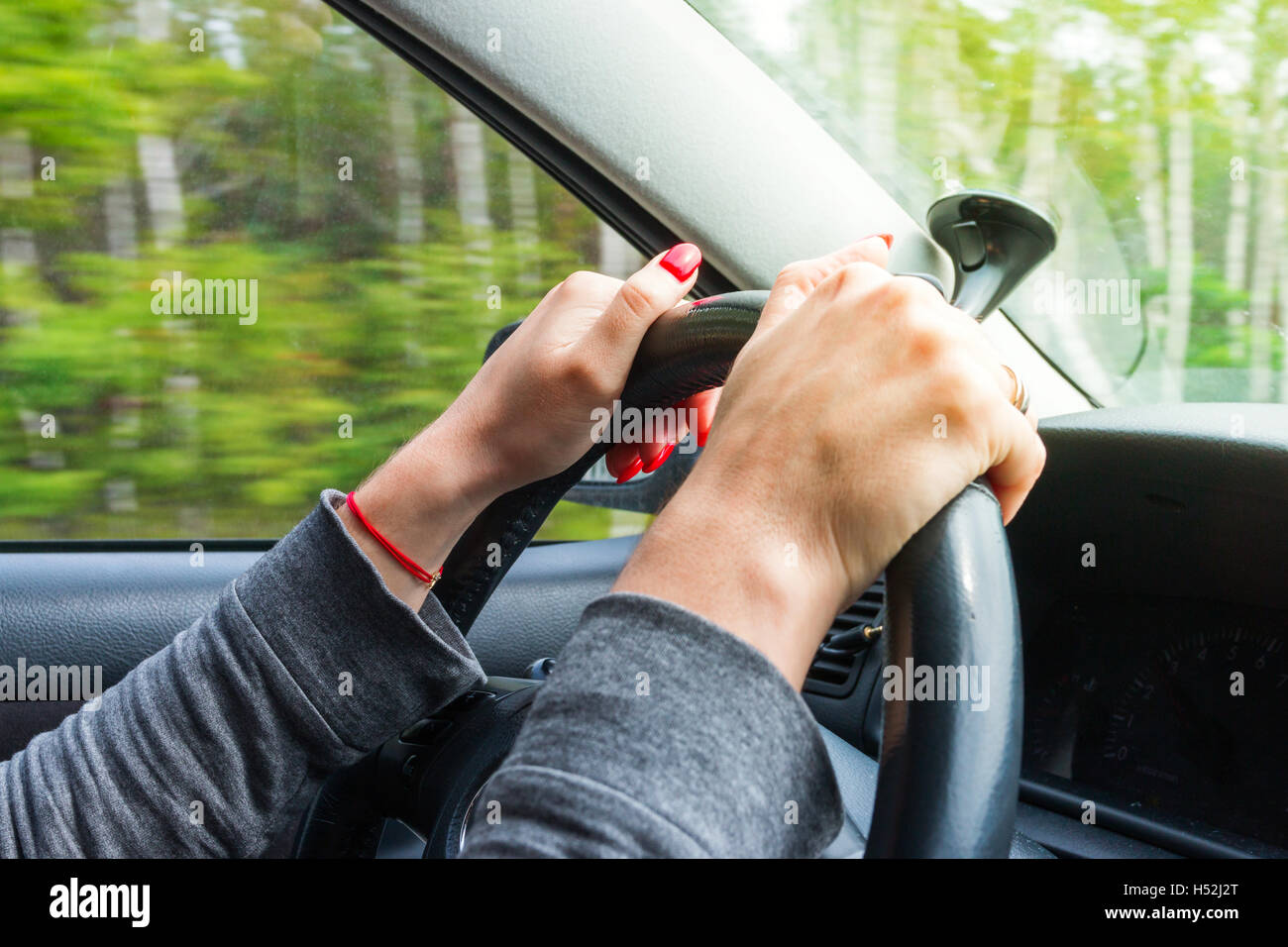 Woman holding steering wheel hi-res stock photography and images - Alamy
