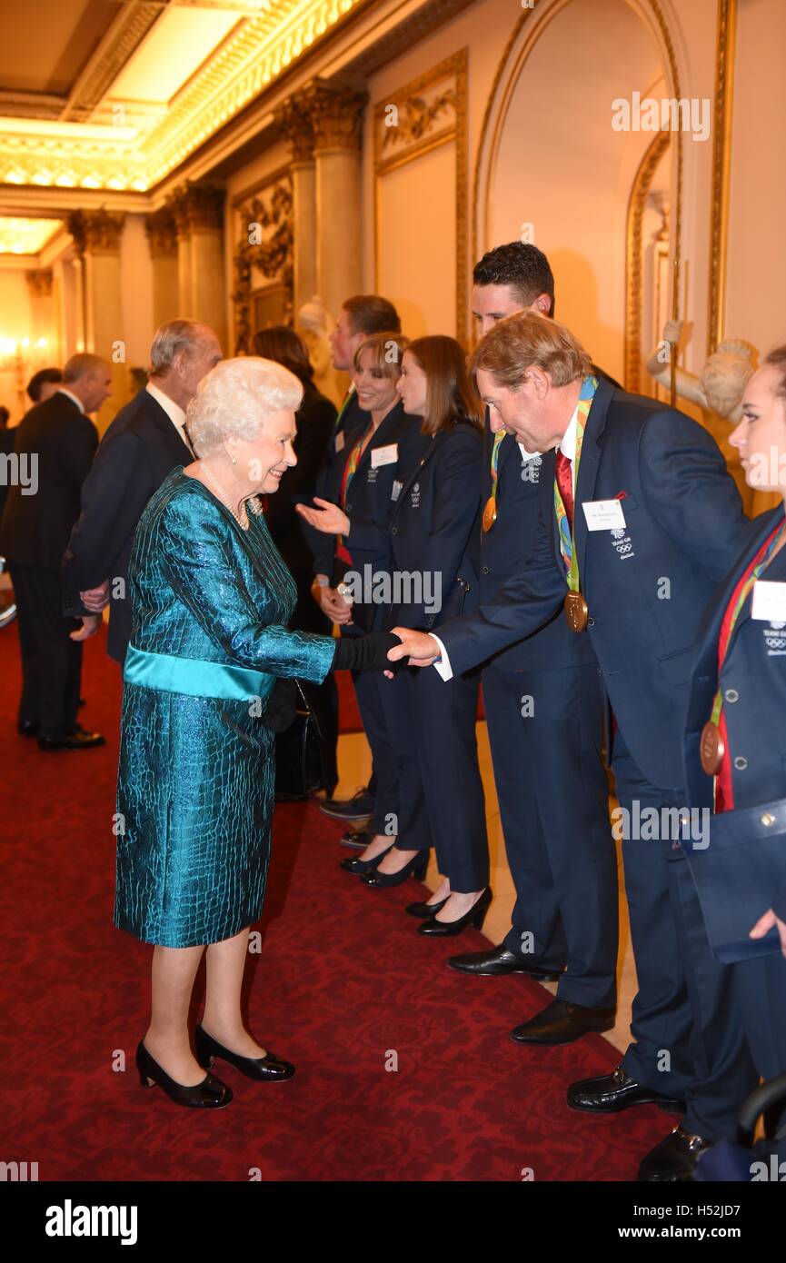 Queen Elizabeth II meets Nick Skelton during a reception for Team GB and ParalympicsGB medallists from the 2016 Olympic and Paralympic Games at Buckingham Palace in London. Stock Photo