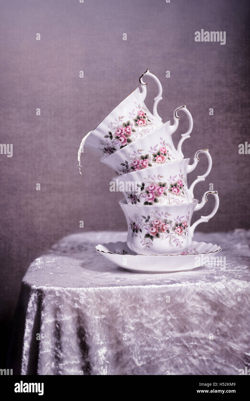 https://c8.alamy.com/comp/H52KM9/stack-of-antique-cups-with-spilt-milk-vintage-tone-filter-effect-added-H52KM9.jpg