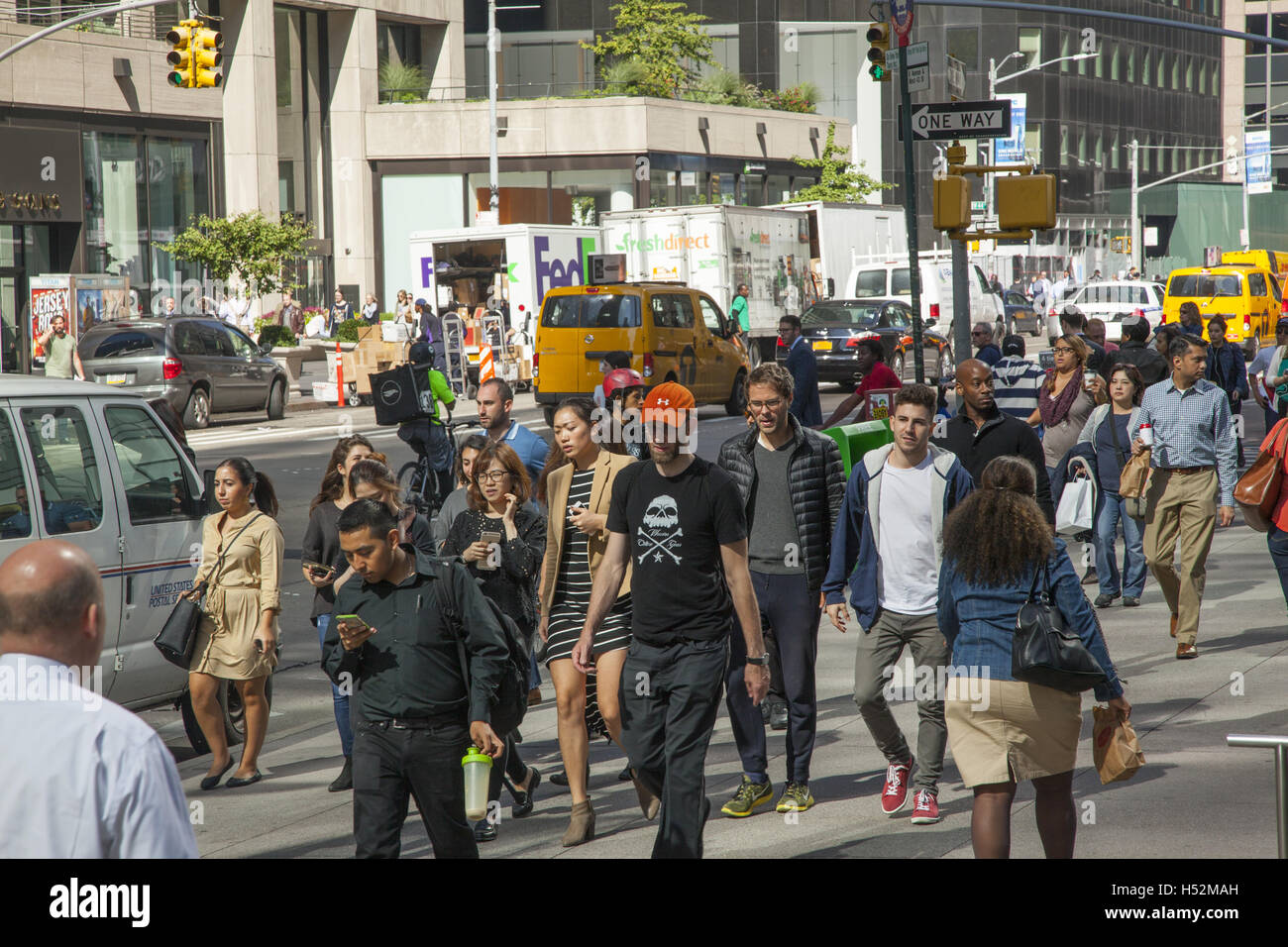 The sidewalk allong 6th Avenue near 42nd Street in midtown Manhattan is always crowded with pedestrians. Stock Photo
