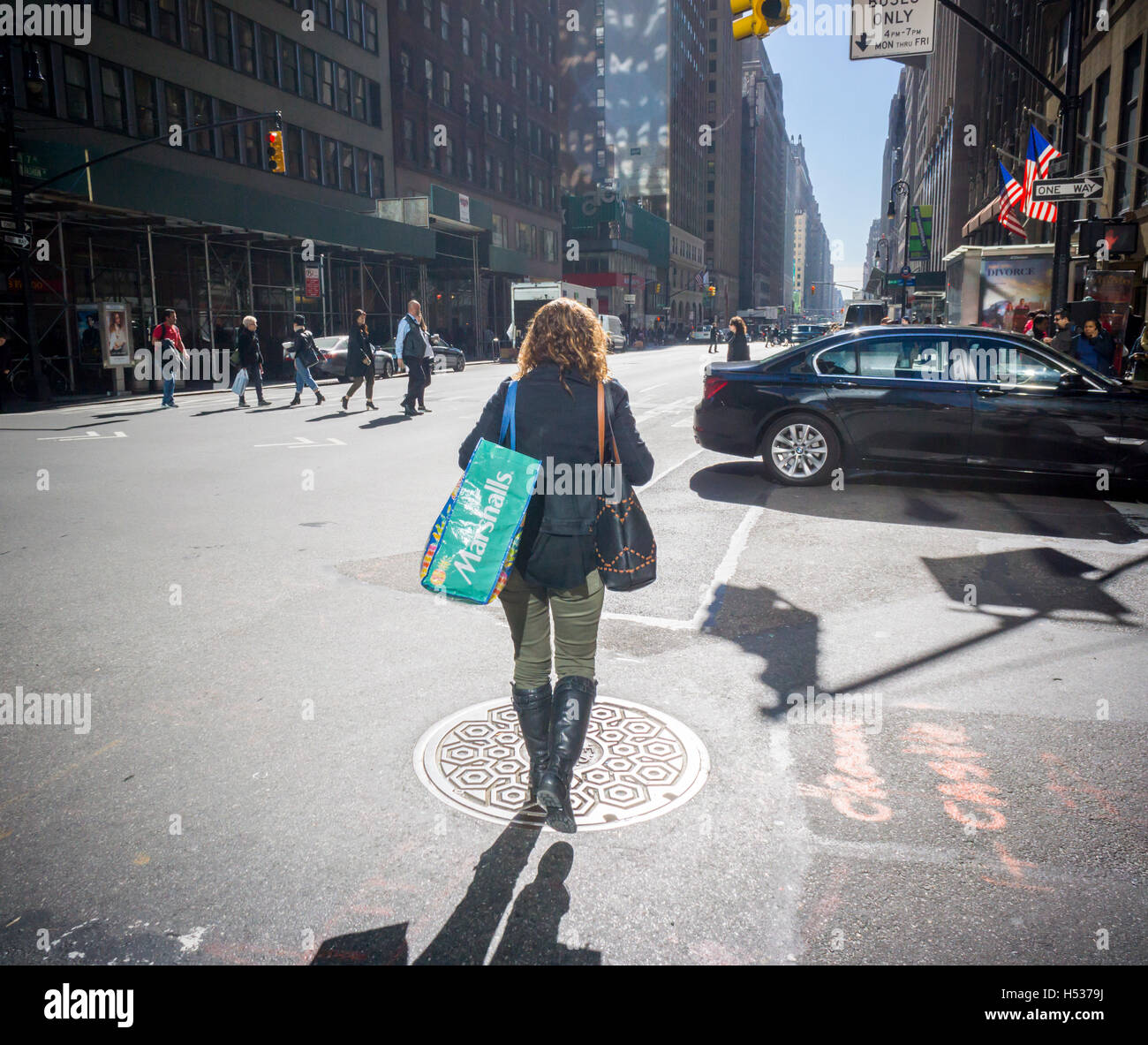 A woman with her Marshalls shopping bag in the Garment District in New