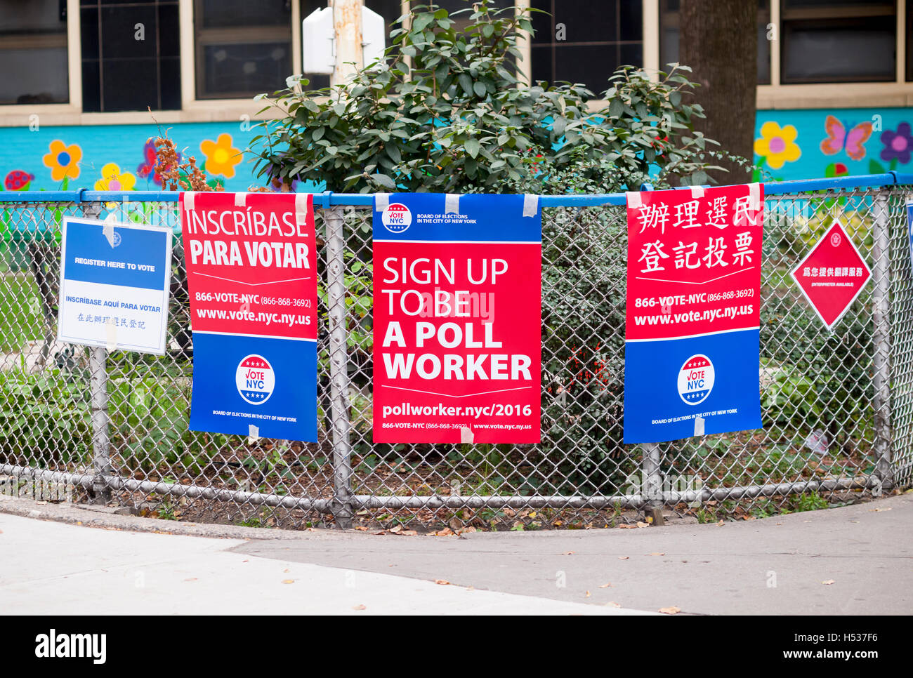 Signs for a voter registration event, with the added advantage of being hired as a poll worker, in New York on Thursday, October 13, 2016. Friday is the last day to register in order to vote in this year's presidential election.  (© Richard B. Levine) Stock Photo