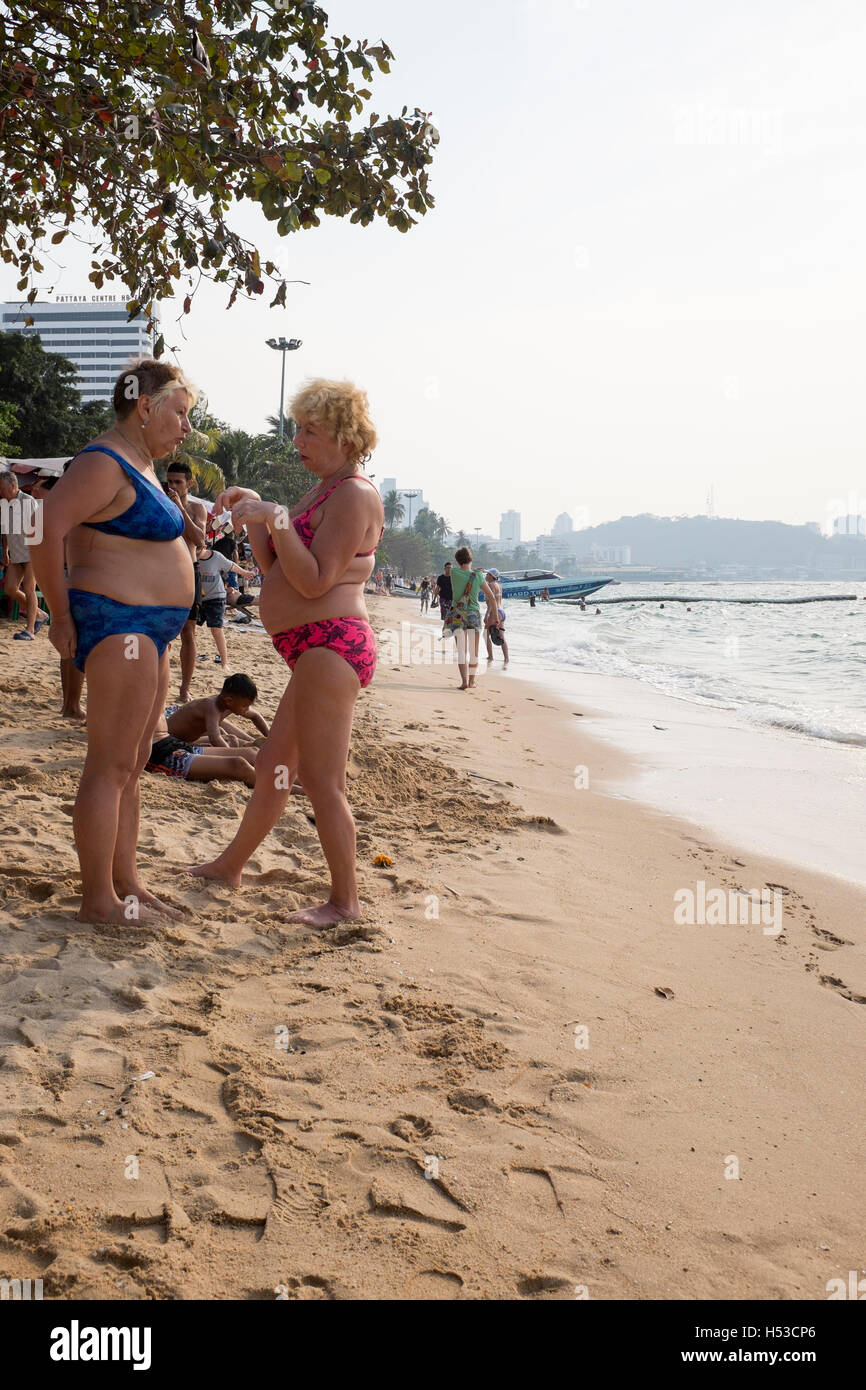 Russian Ladies in Bikinis Chatting on Pattaya Beach Pattaya Thailand Stock Photo