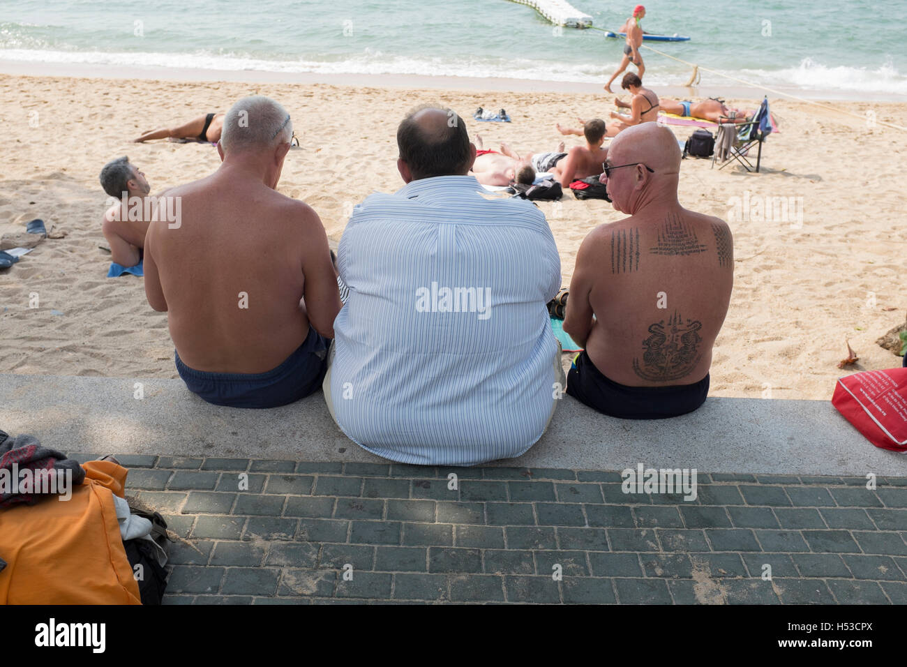 Overweight Man on the beach in Pattaya Thailand Stock Photo