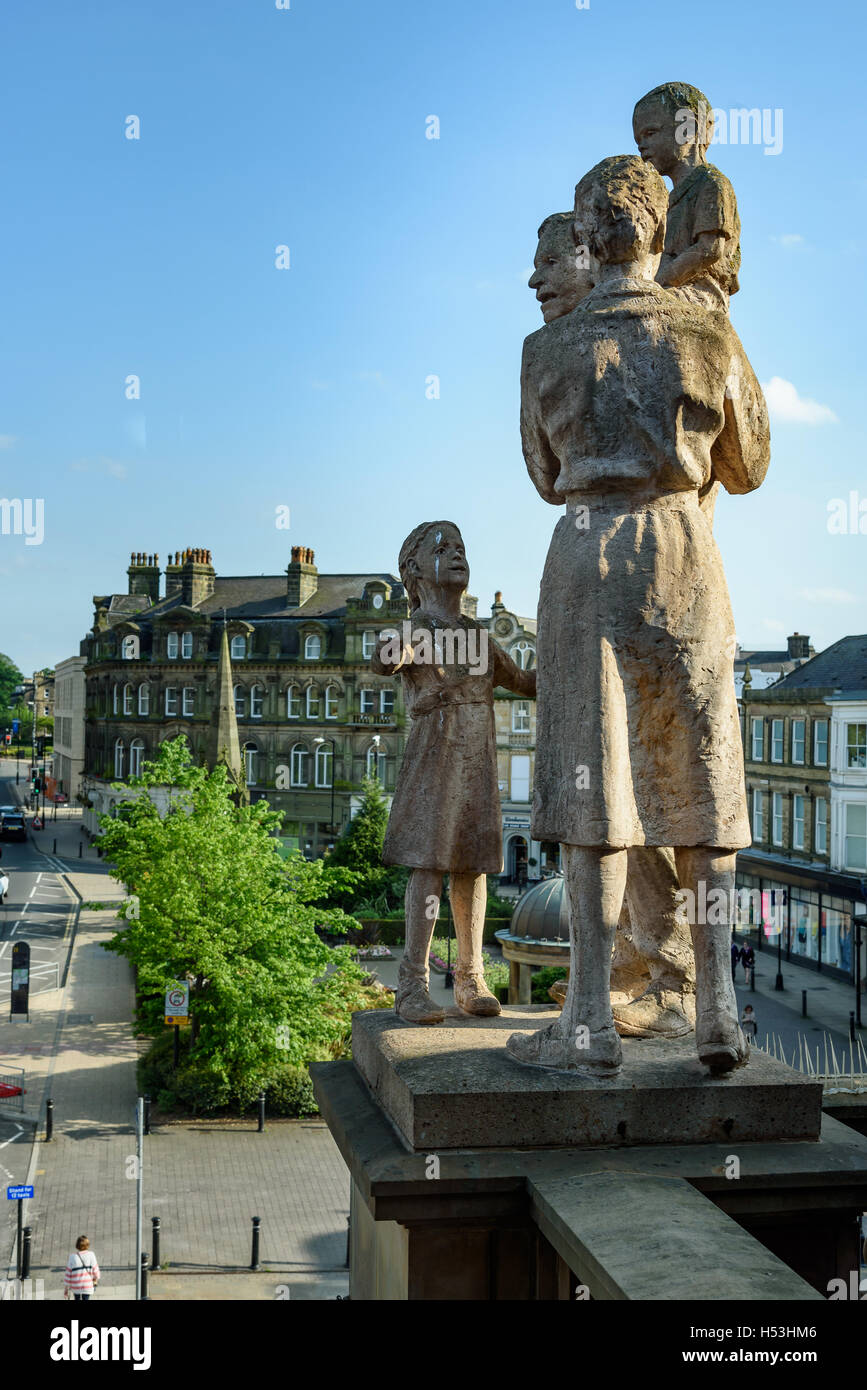 High statues depicting a family above a shopping mall in Harrogate Yorkshire England UK. Stock Photo