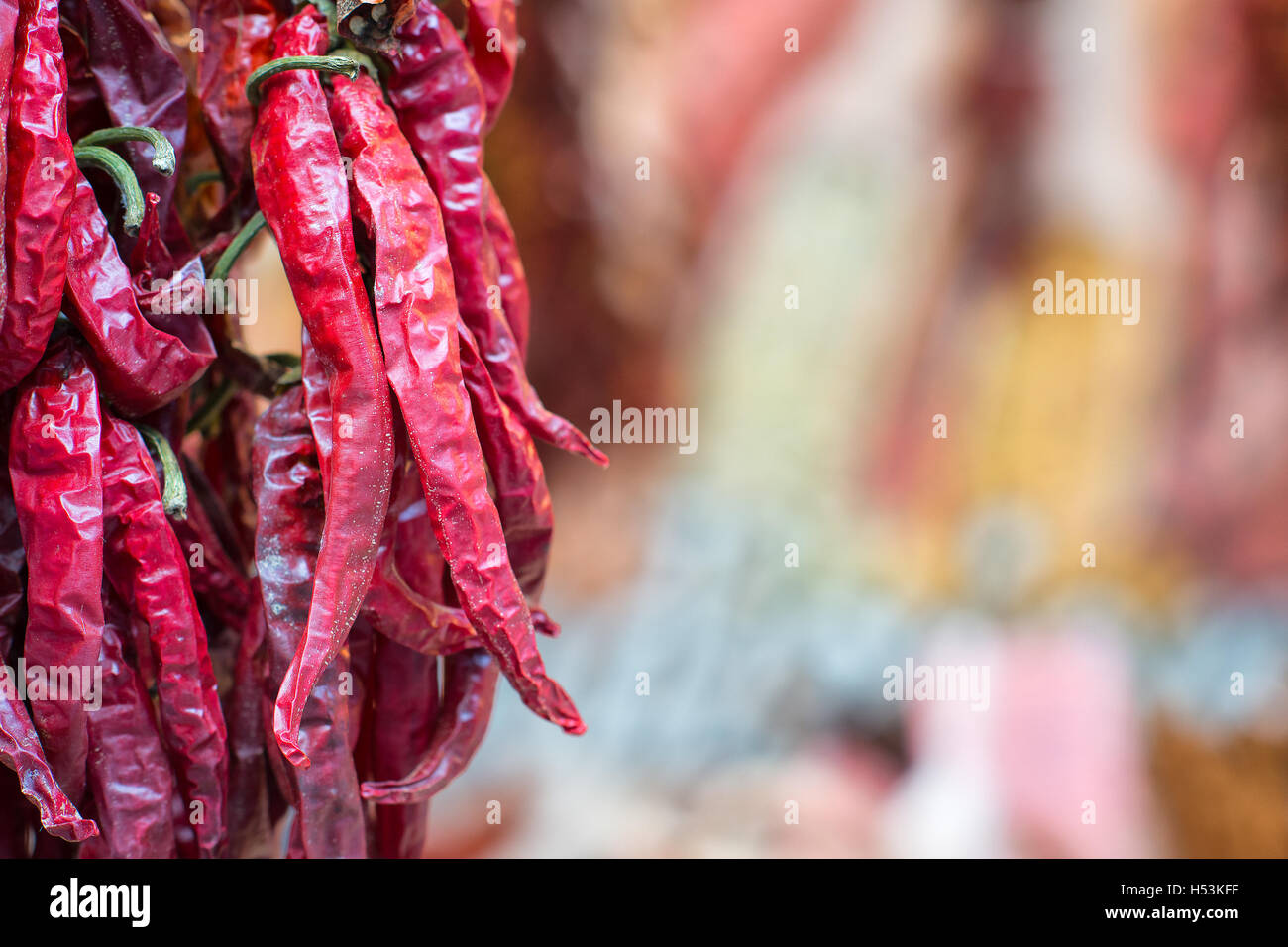 Hot peppers hanging in a market in the street in the city Stock Photo ...