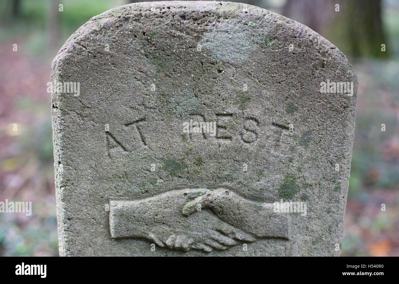 An old grave marker with the words "at rest Stock Photo Alamy