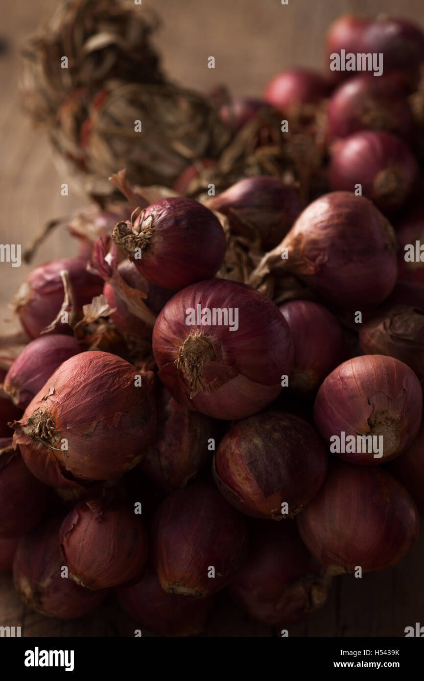 shallots still life wood background onion bulb season herb vegetable ingredient close up Stock Photo