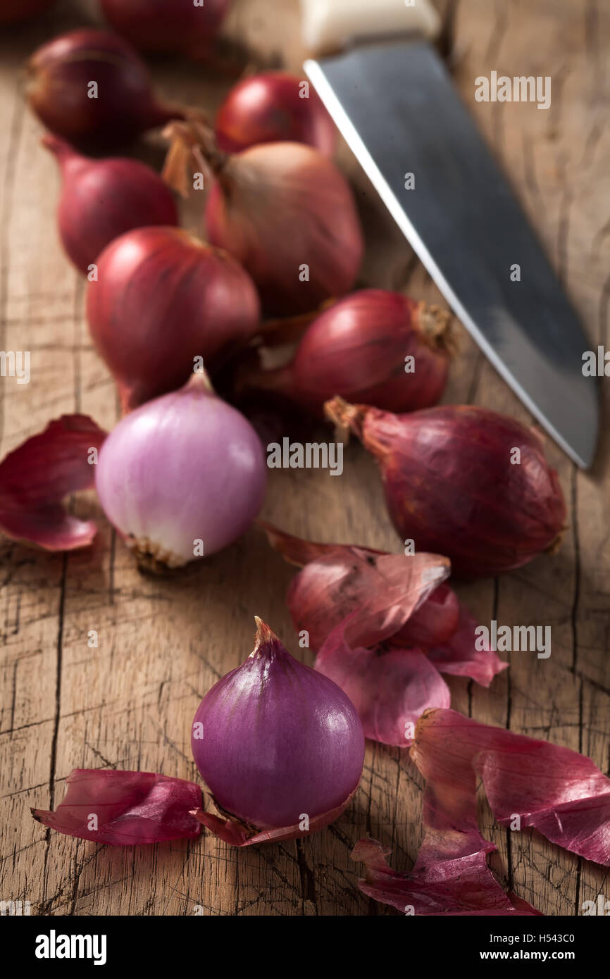 shallots still life wood background onion bulb season herb vegetable ingredient close up Stock