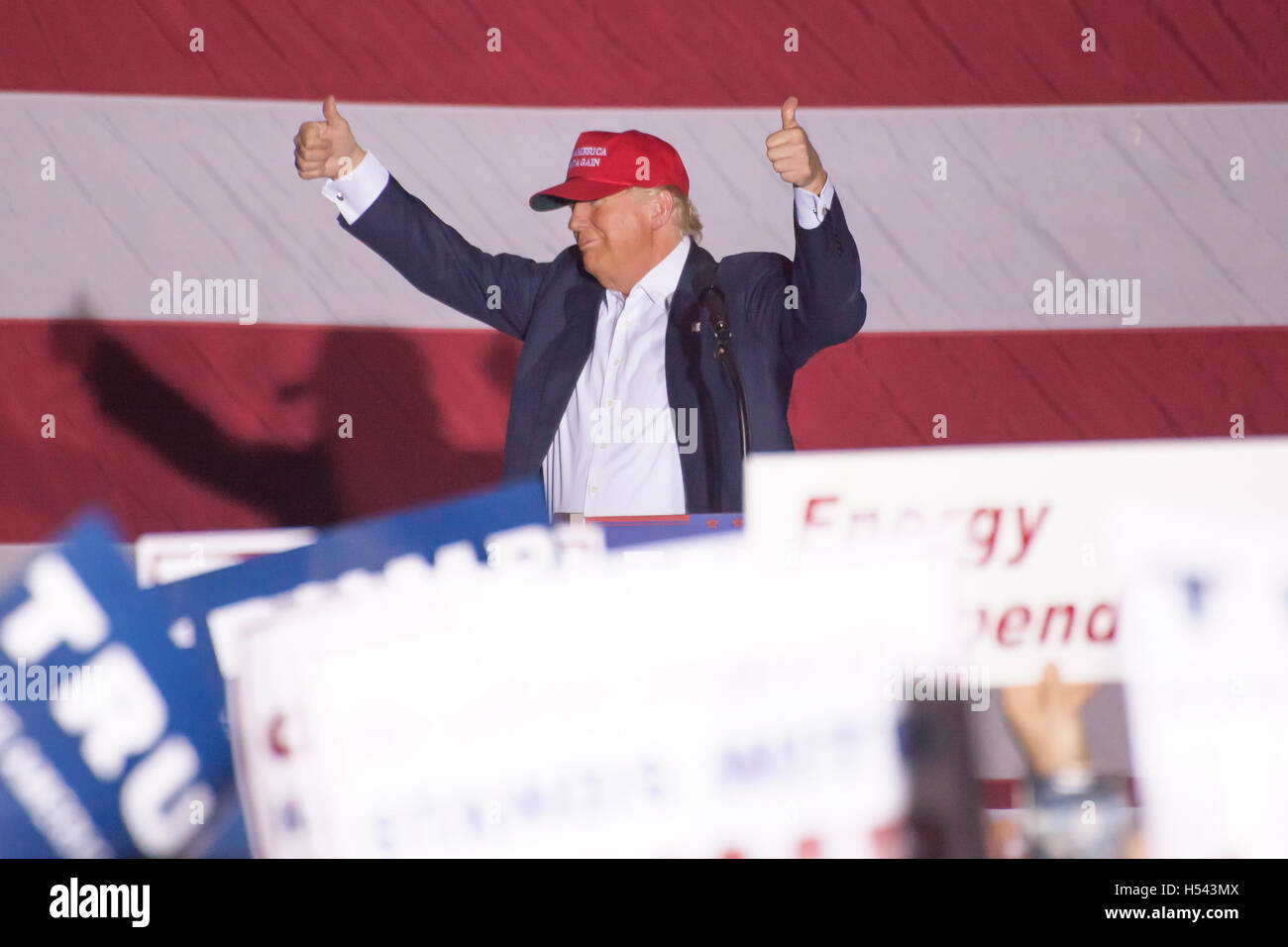 Donald J Trump puts two thumbs up while speaking to a crowd of ...