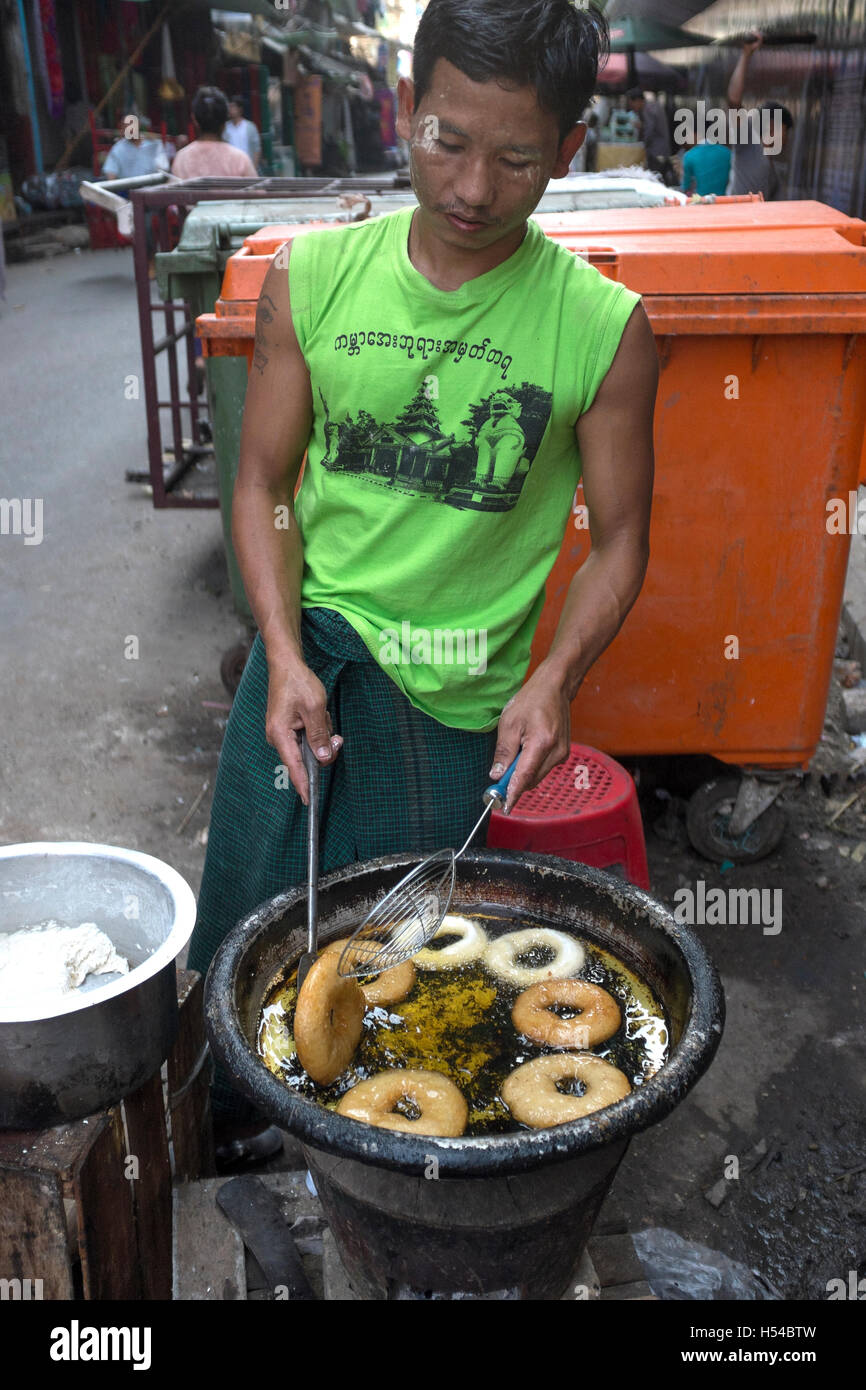 Frying Doughnuts at Street Food Stall in Yangon Myanmar Stock Photo