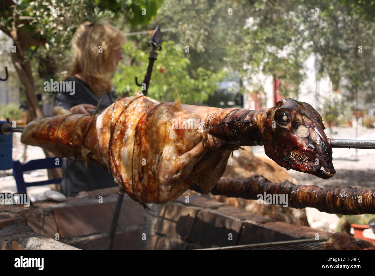 Easter lamb on charcoal spit together with a kokoretsi in Kyparissi village...