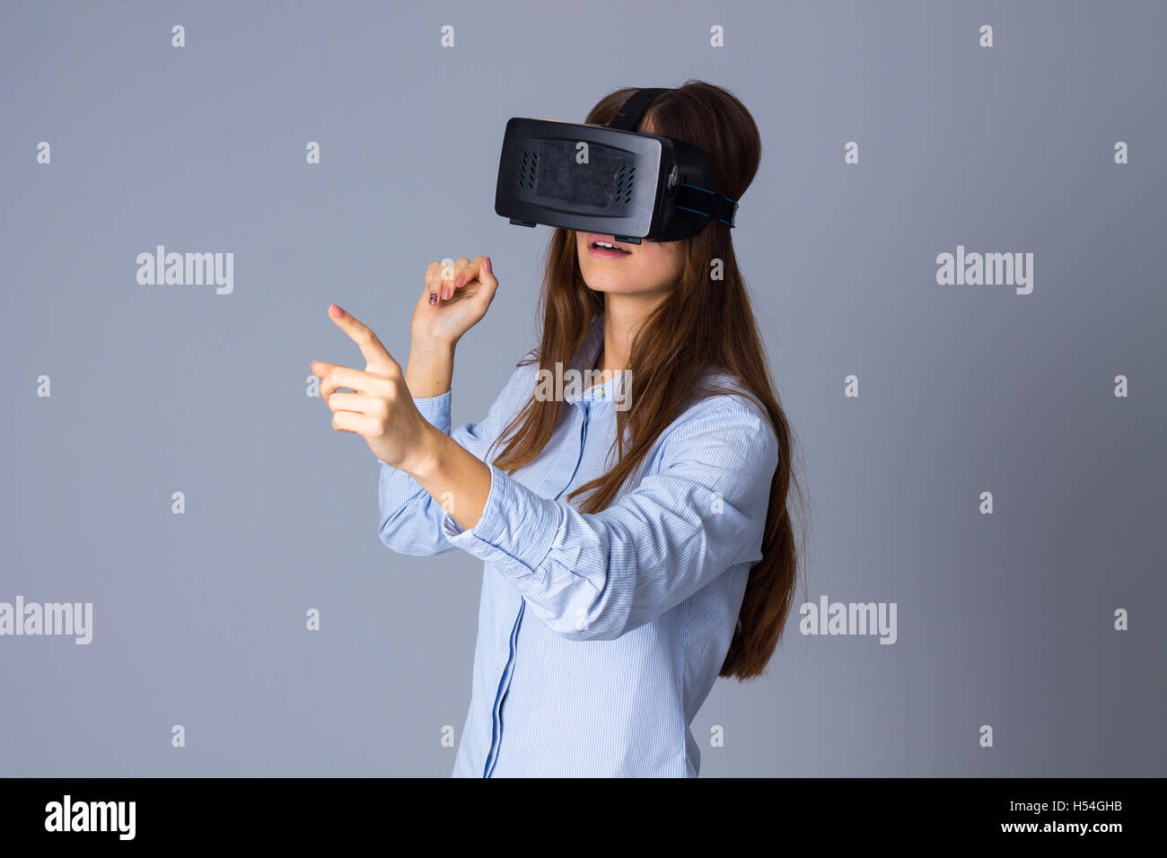 Woman using VR glasses Stock Photo - Alamy