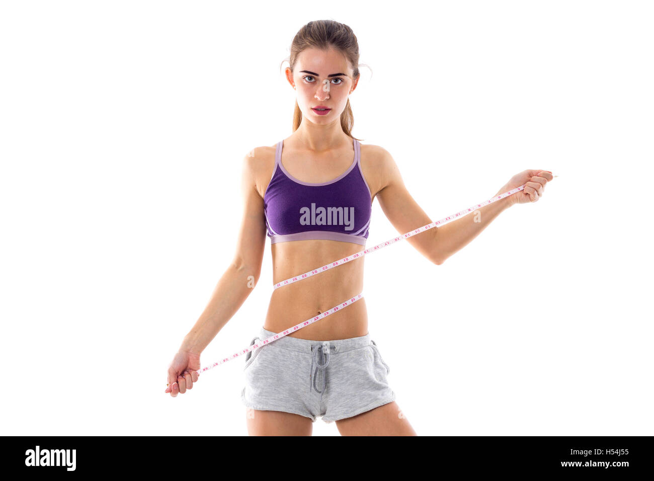 Athletic woman holding cantimeter Stock Photo