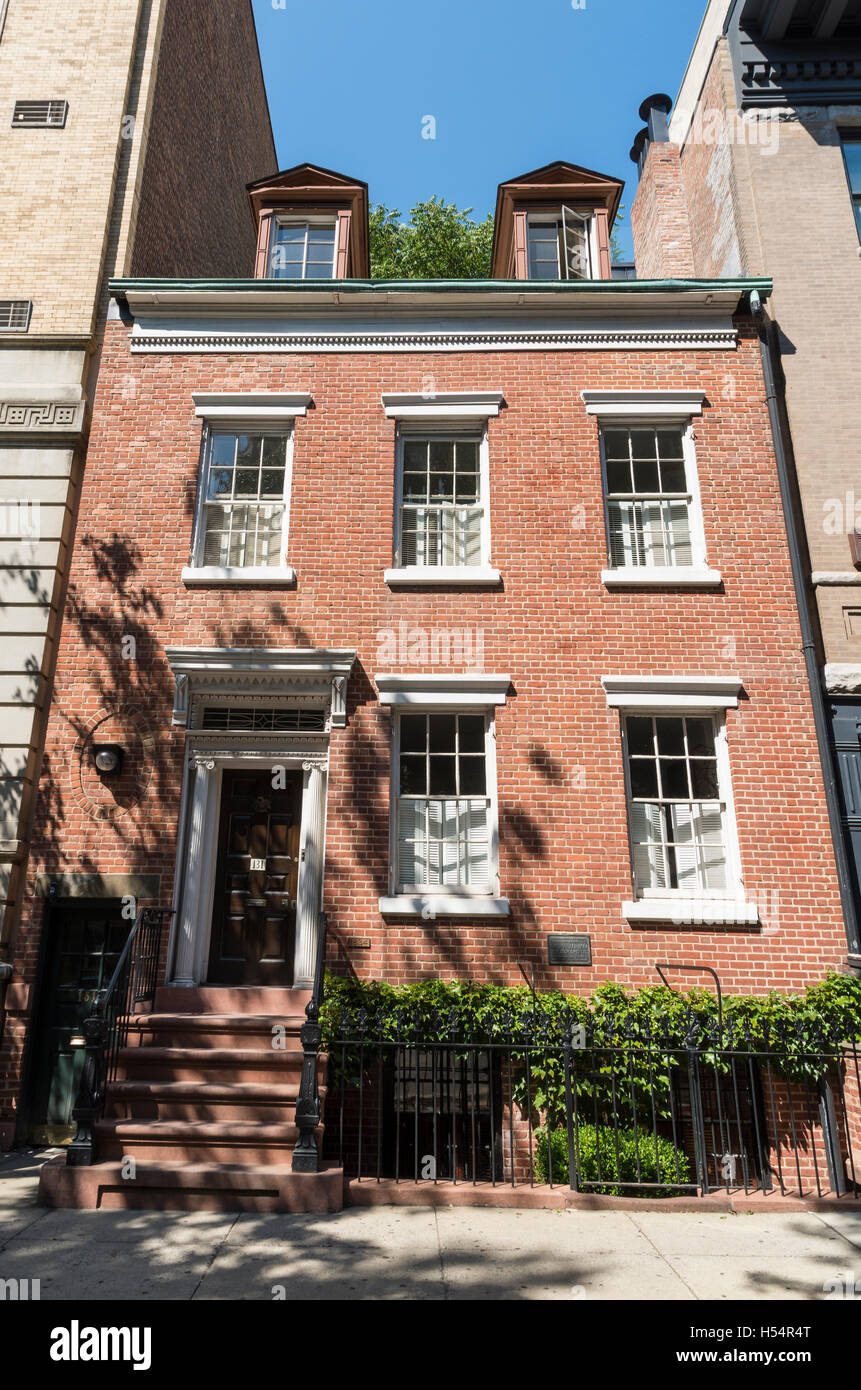 Exterior facade of landmarked Federal style rowhouse townhouse on Charles Street, New York. Stock Photo