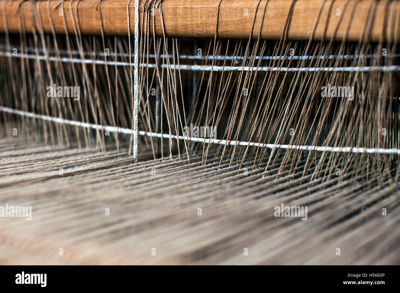 Weaving machine with some fabric. Stock Photo