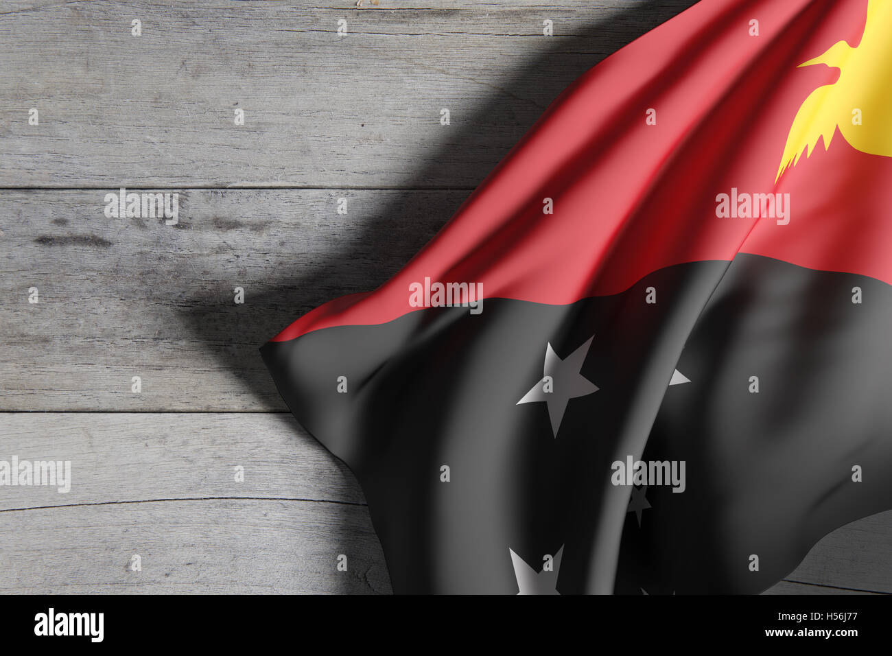 3d rendering of  Independent State of Papua New Guinea flag waving on wooden background Stock Photo