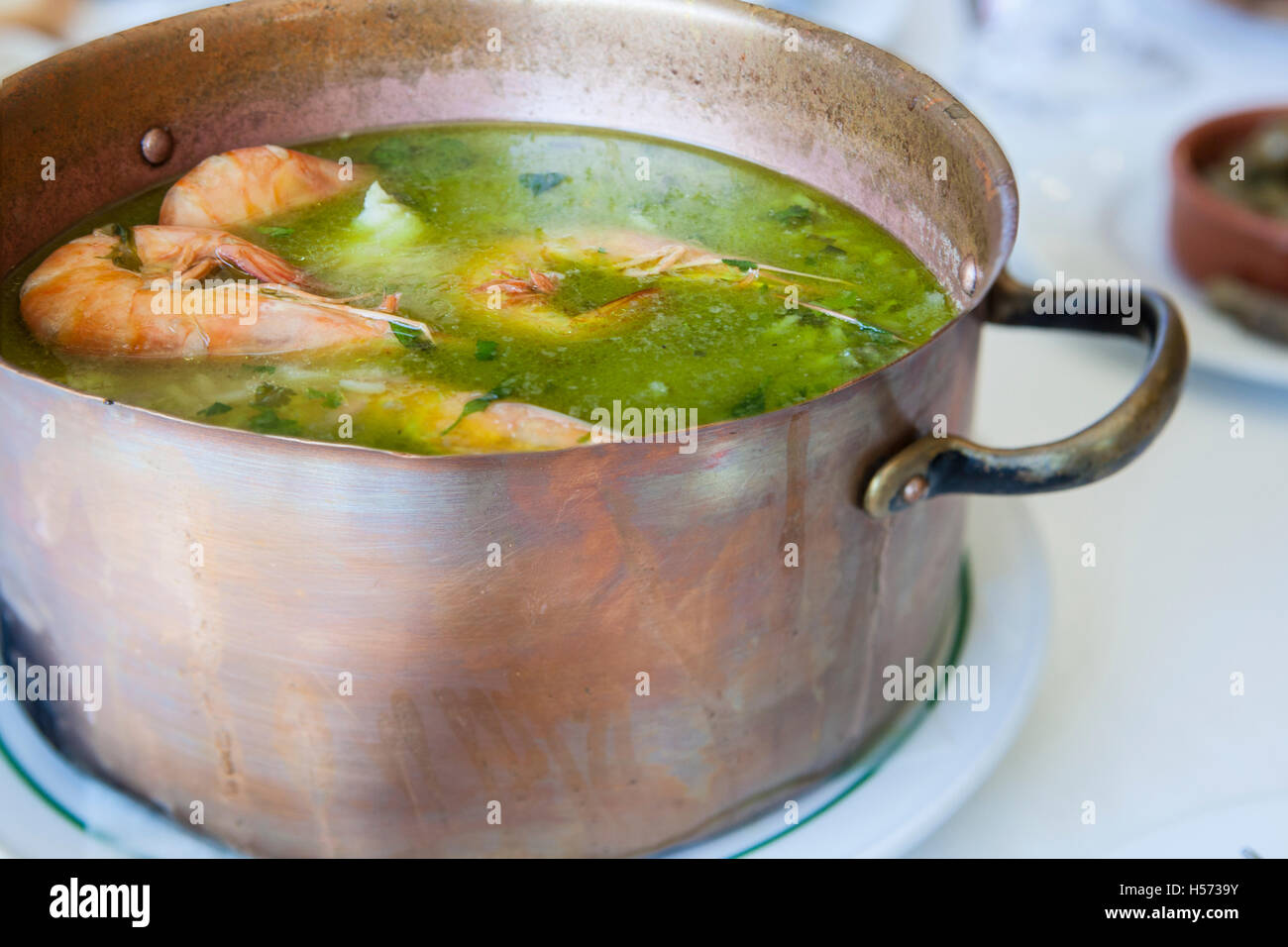 Arroz de Tamboril or soupy seafood rice, portuguese recipe Stock Photo