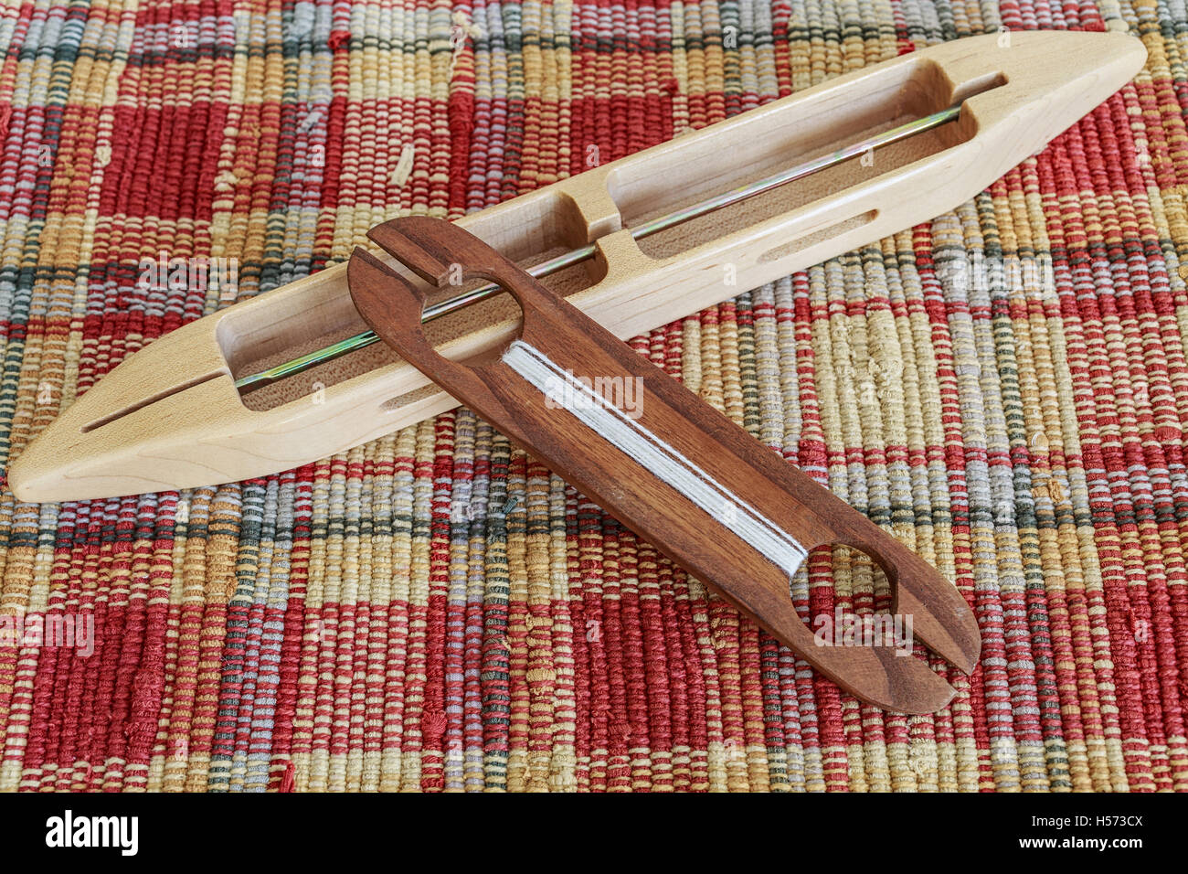 A pair of different types of weaving shuttles Stock Photo Alamy