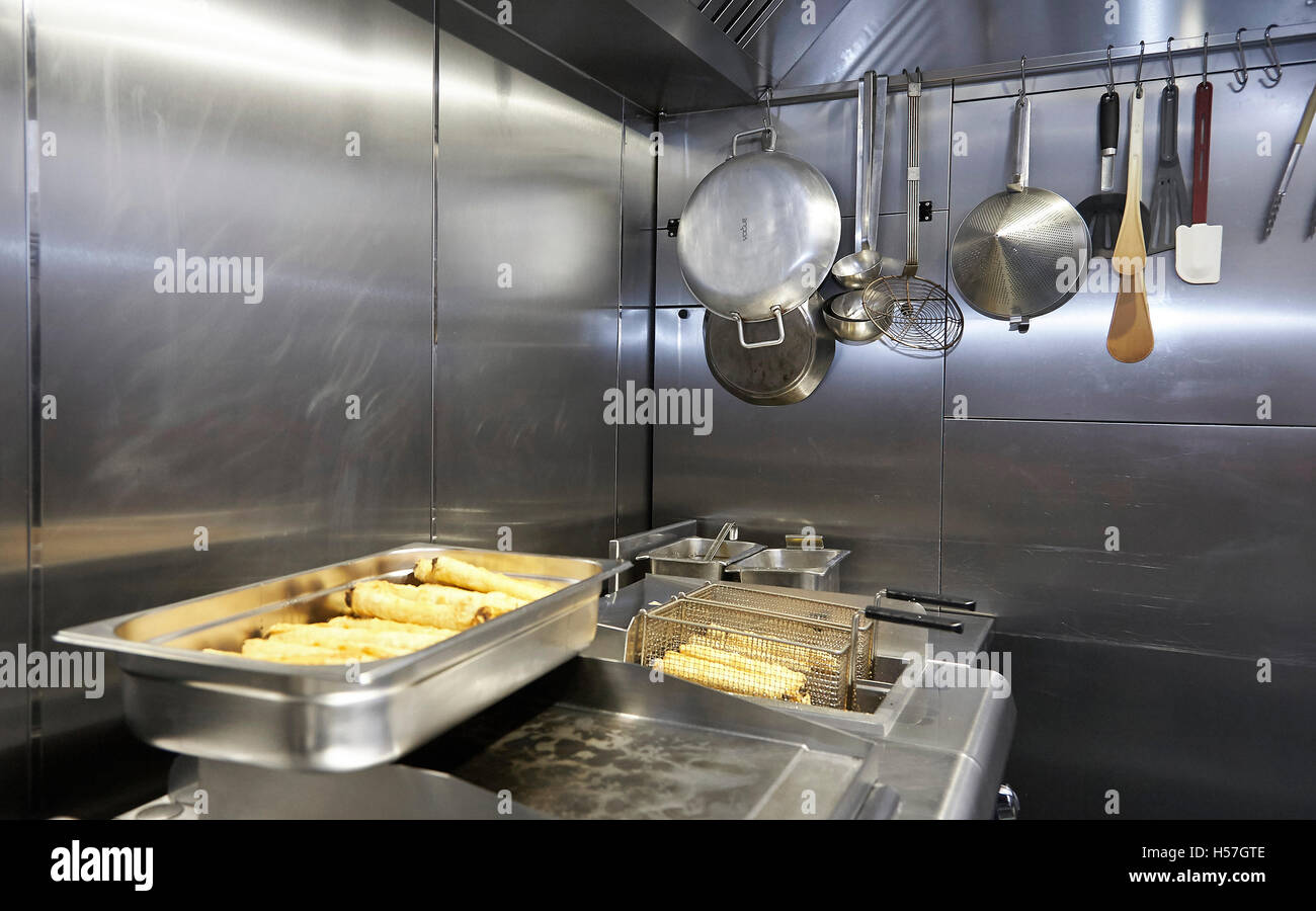 Deep fryers in use in a commercial kitchen in the UK. Stock Photo