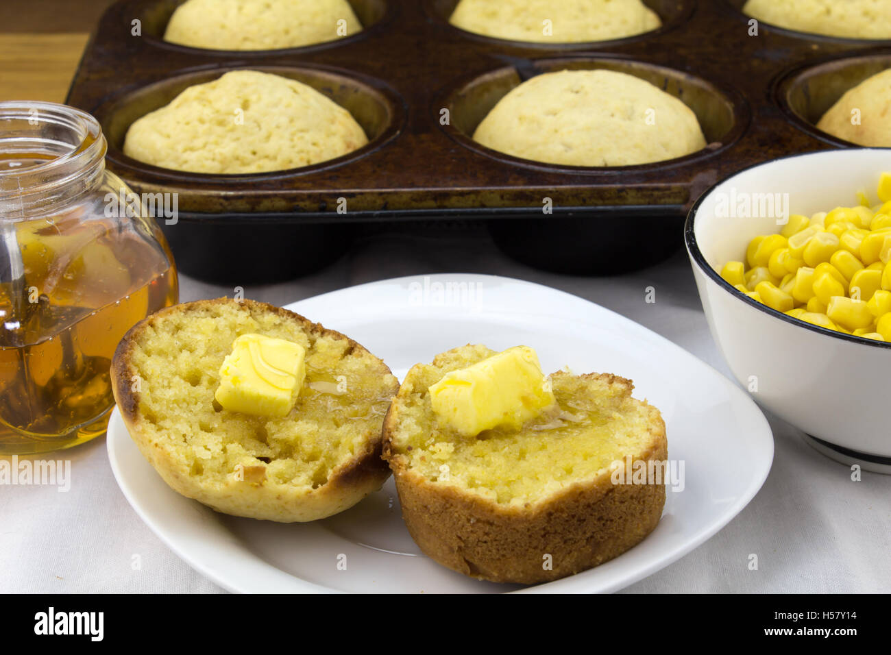 Corn muffins with butter Stock Photo Alamy