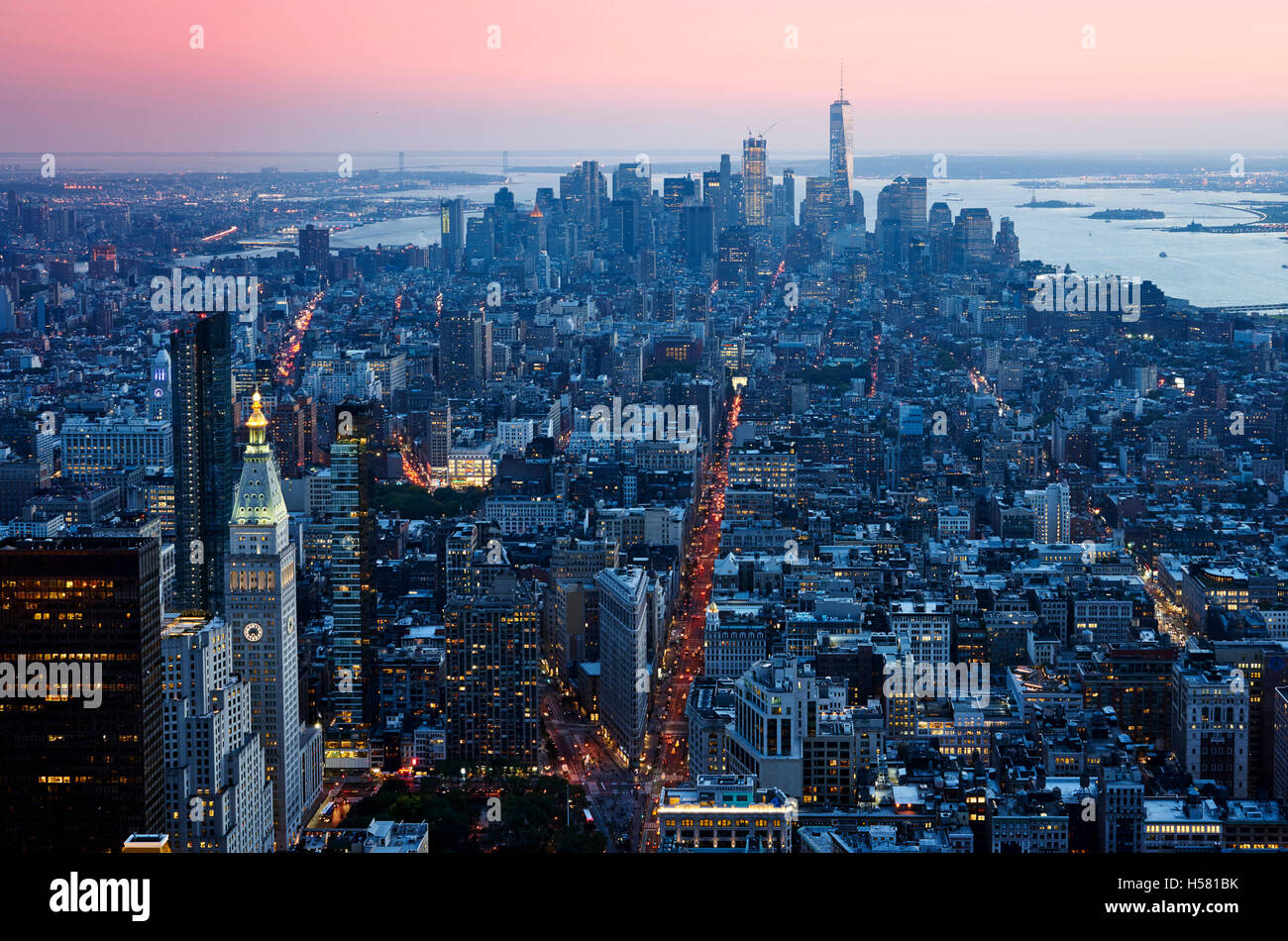 Sunset Manhattan down town aerial view from skycarpenter in warm light Stock Photo