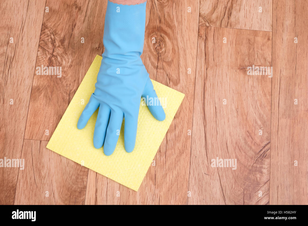 A hand cleaning a parquet floor Stock Photo Alamy