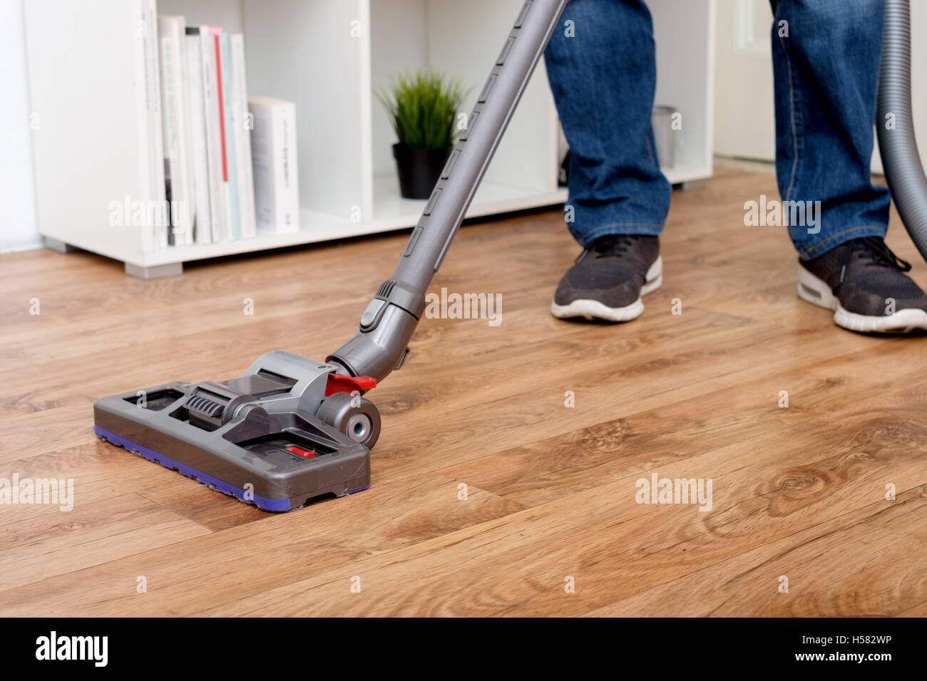 Hoovering a parquet floor Stock Photo Alamy