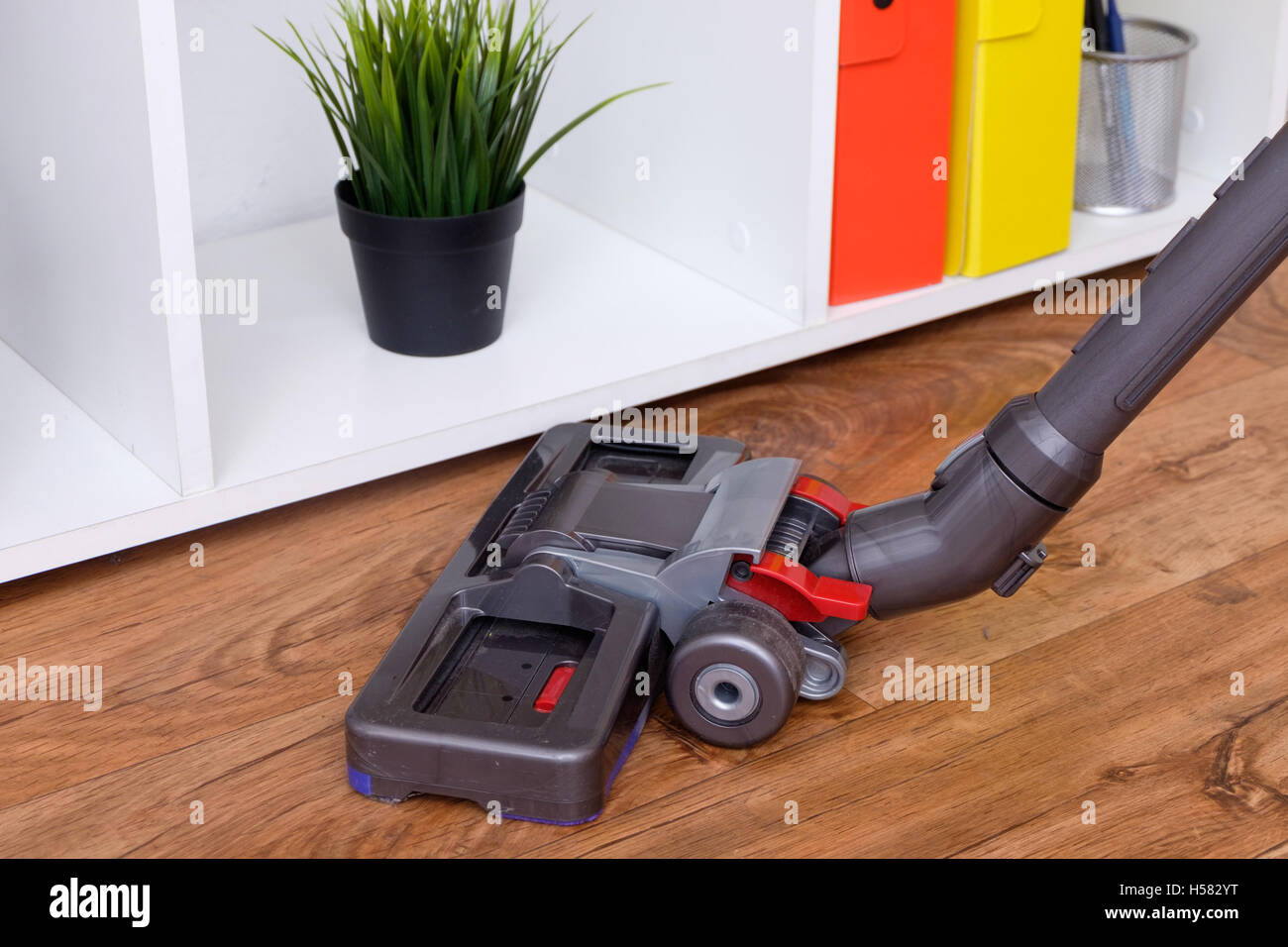 Hoovering a parquet floor Stock Photo Alamy