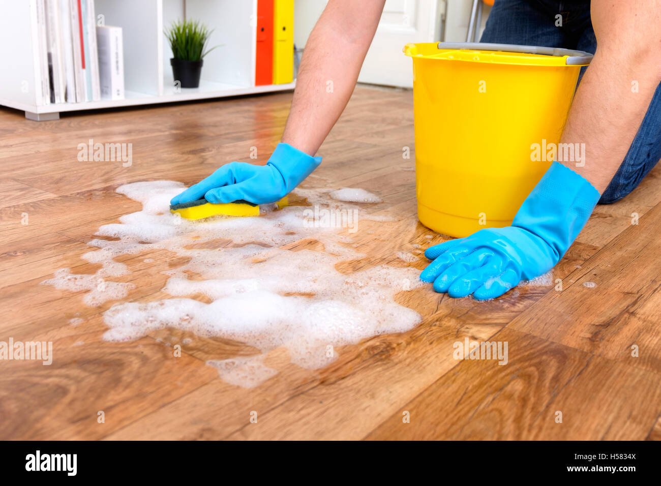 Cleaning a parquet floor with foam on the floor Stock Photo Alamy