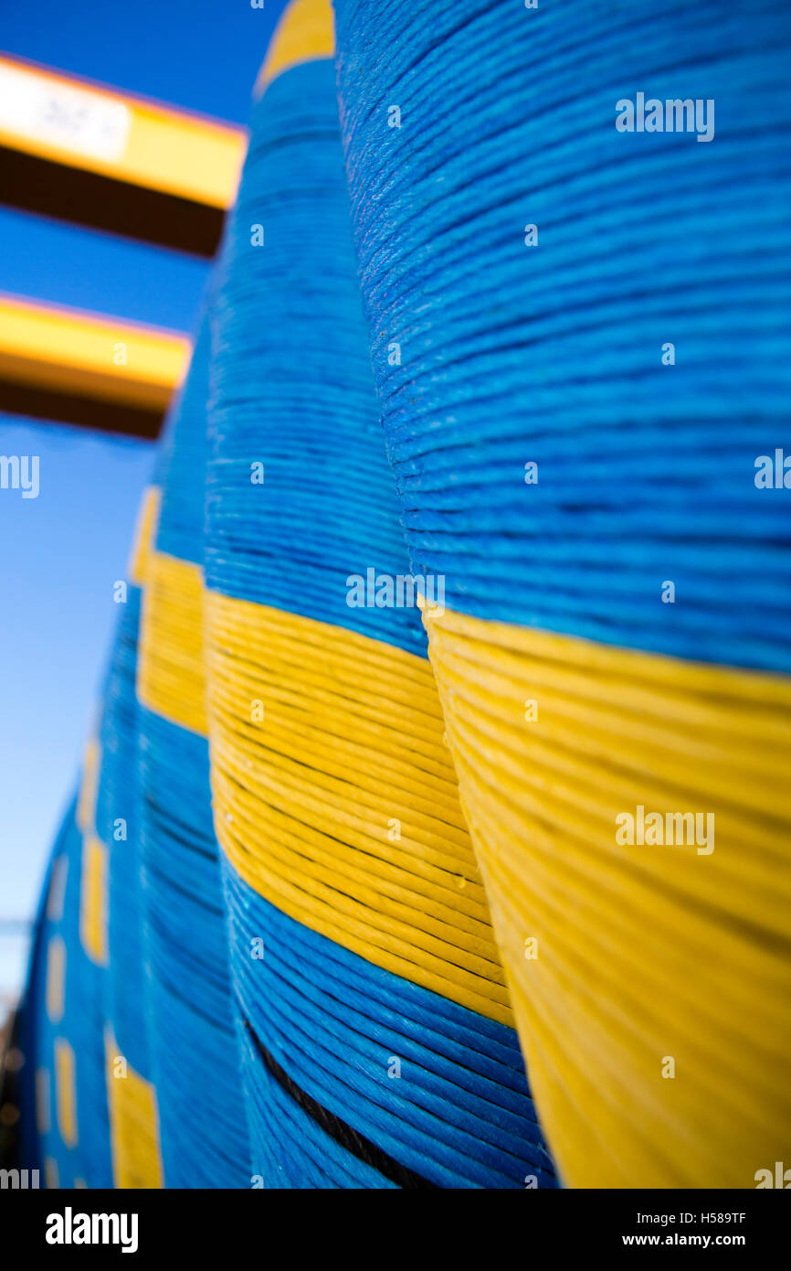 Coloured,bound spools or feels of cable in manufacturing plant, in Uk industry Stock Photo Alamy