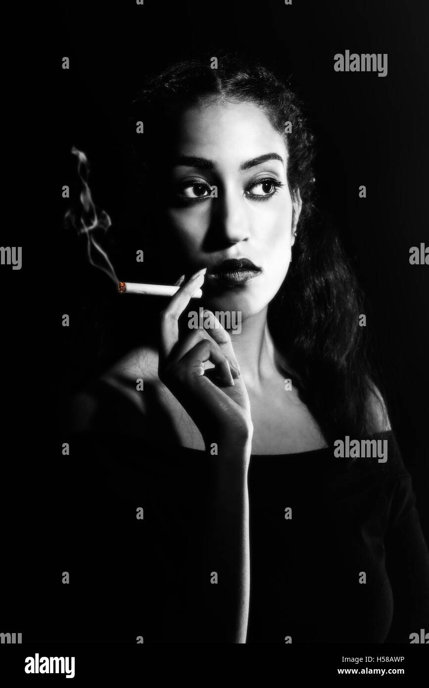 Femme fatale smoke hi-res stock photography and images - Alamy, image size:867x1390