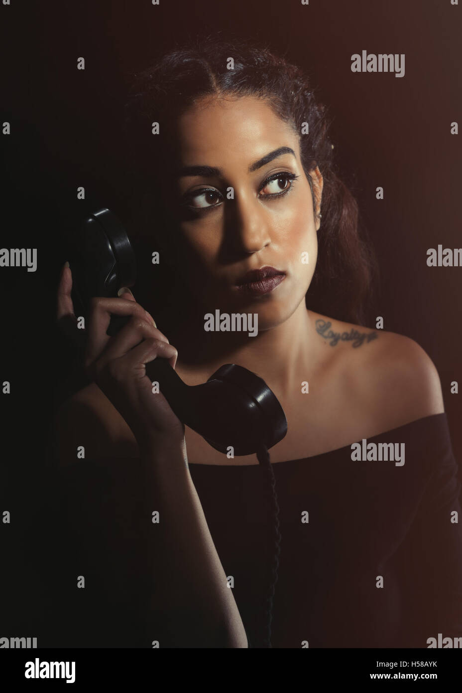 Portrait of a British Asian woman on the telephone Stock Photo