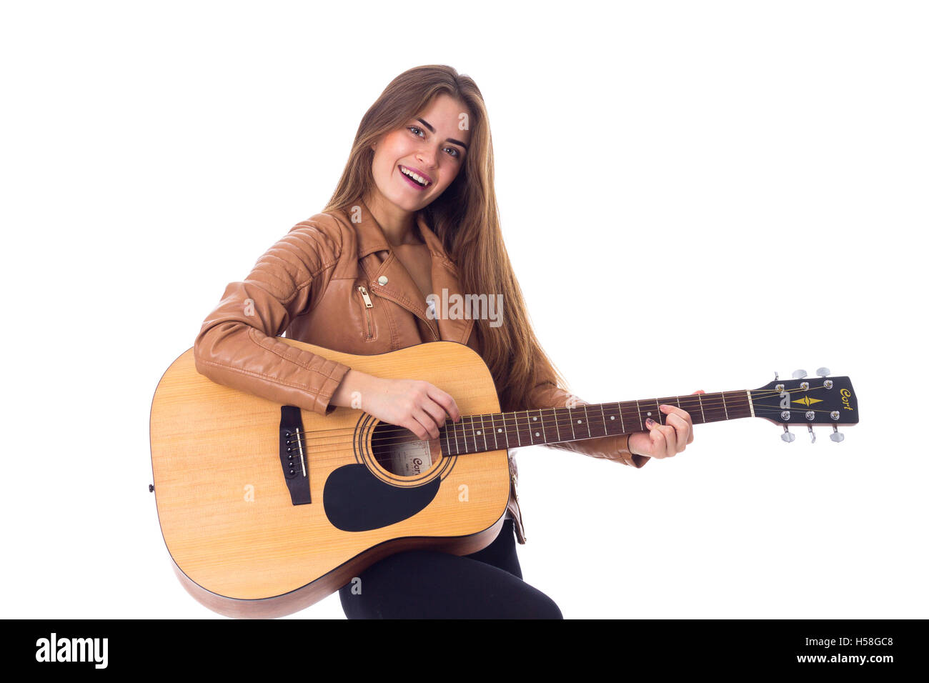 Young woman holding a guitar Stock Photo - Alamy