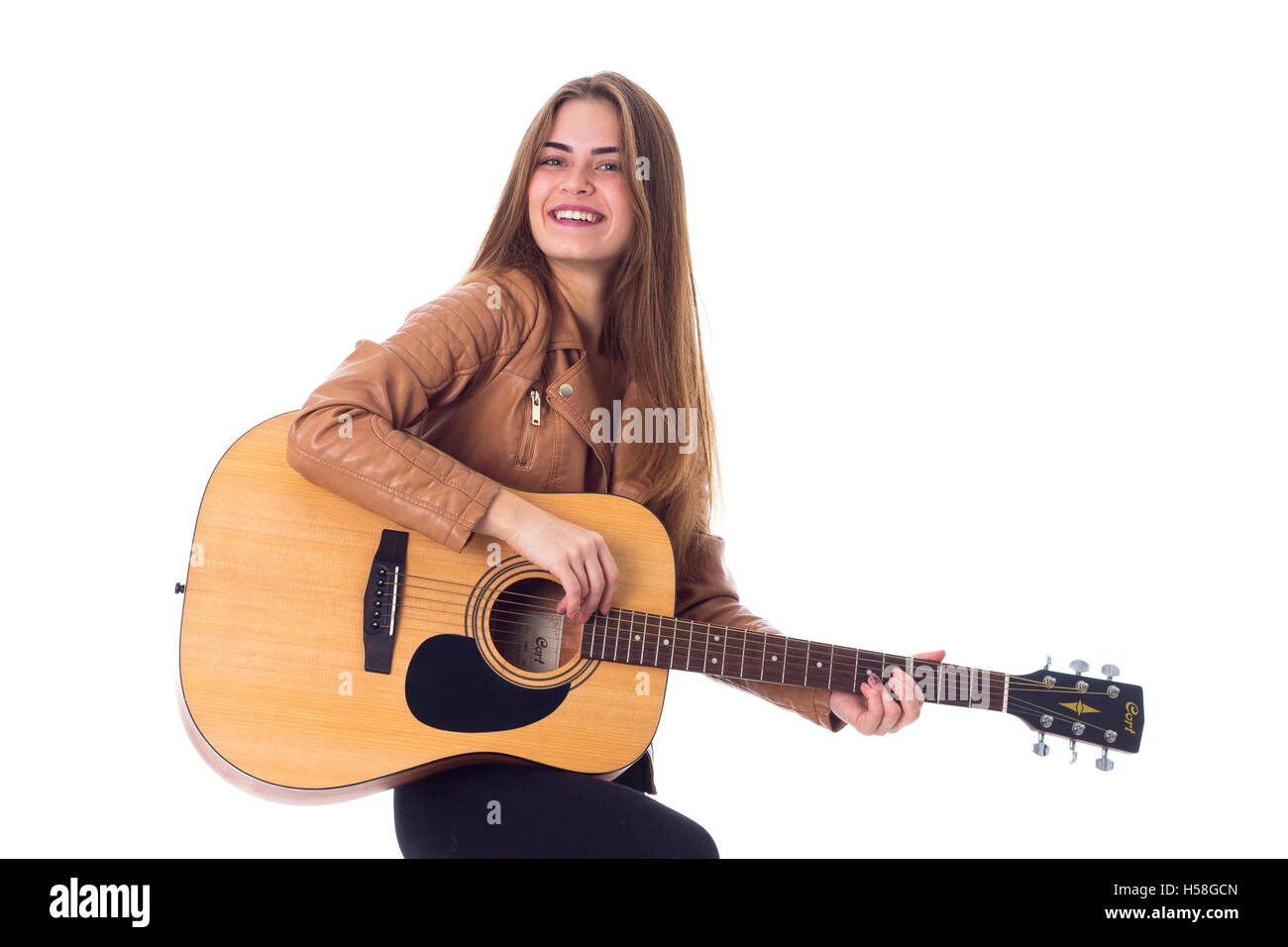 Young woman holding a guitar Stock Photo - Alamy