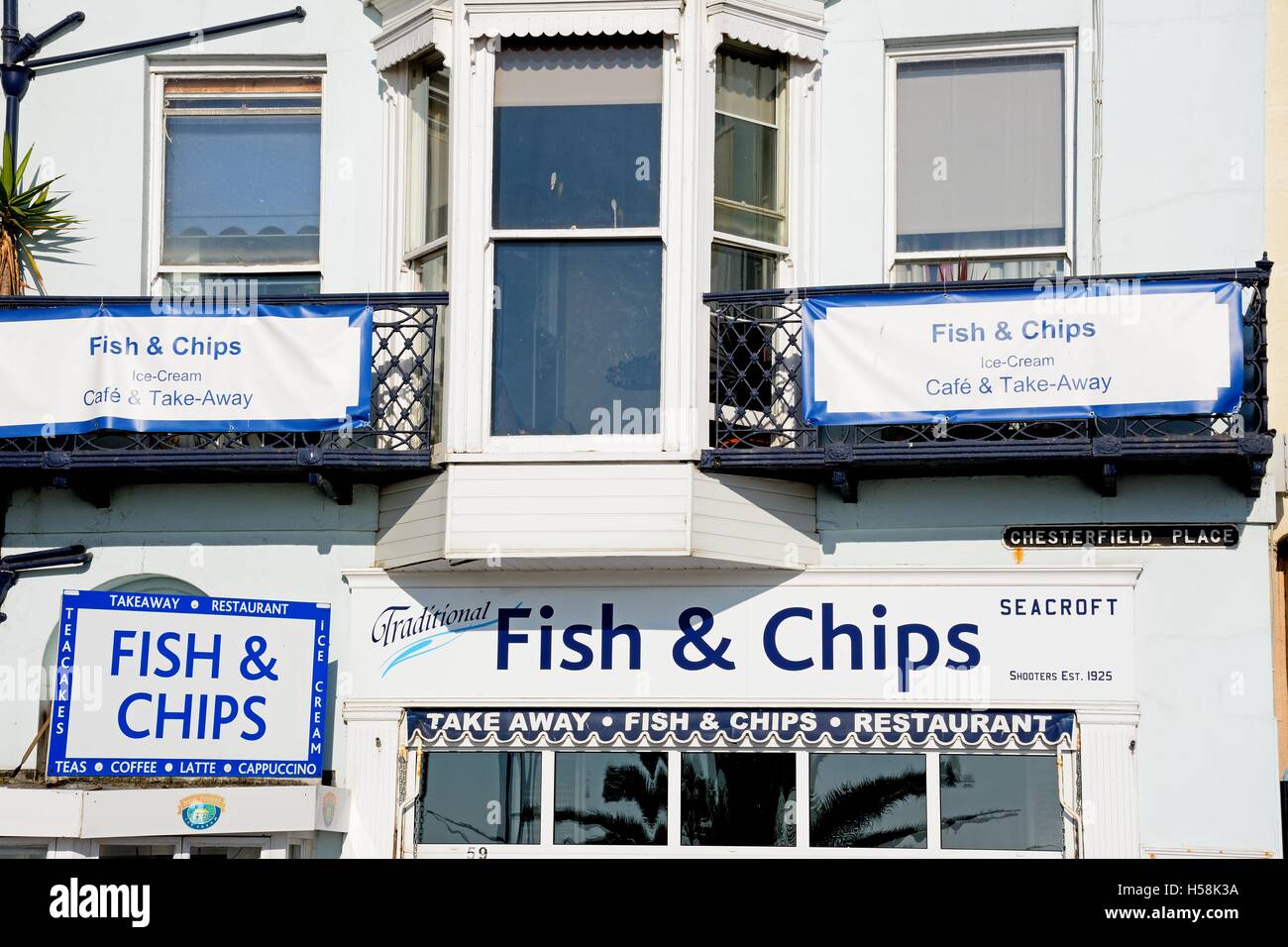 Traditional fish and chips shop signs along the Esplanade, Weymouth, Dorset, England, UK
