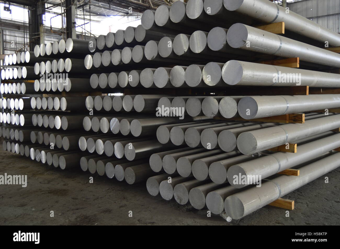 primary aluminum metal cylinders employed in the extrusion process. Stock Photo