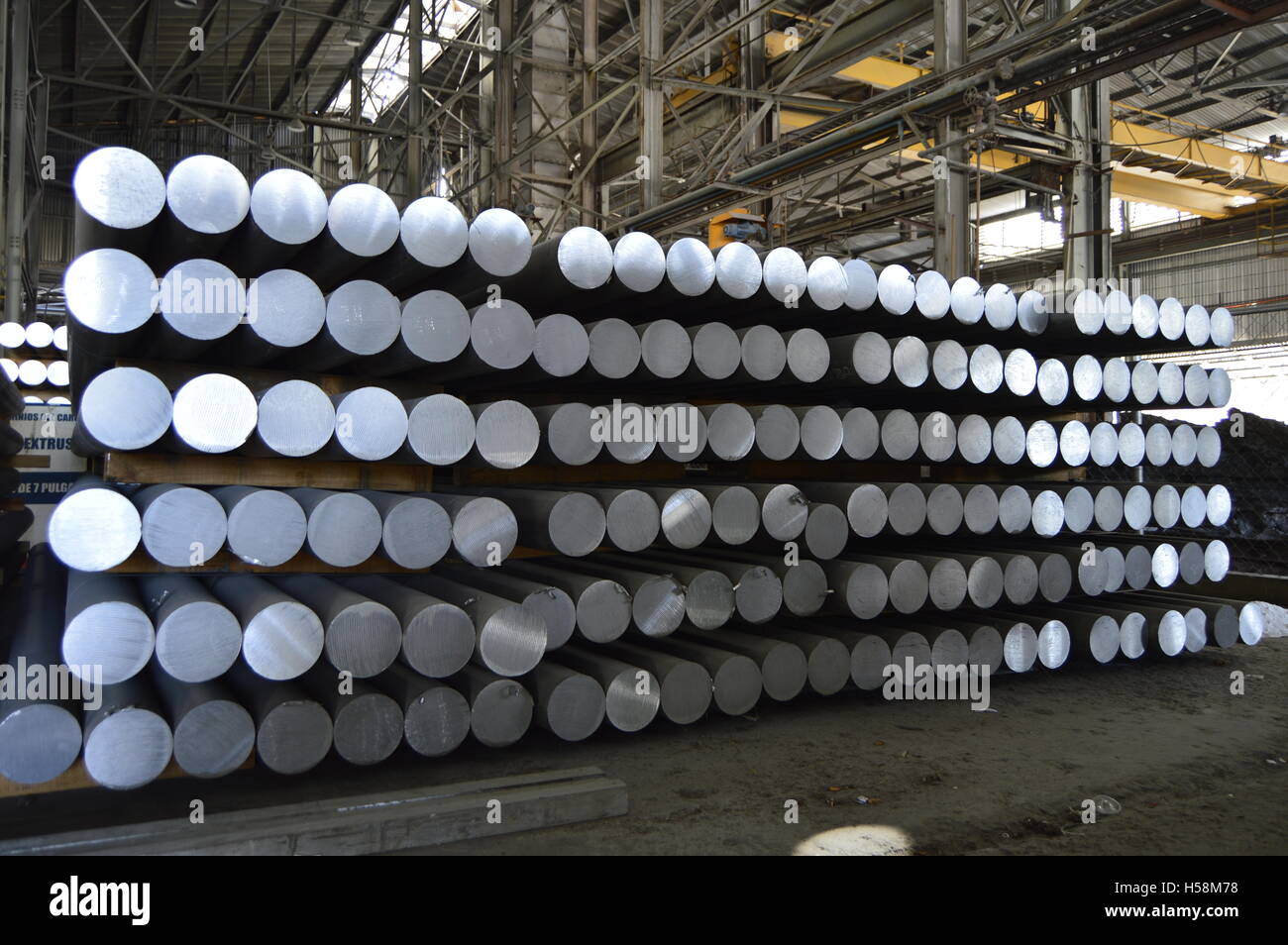 primary aluminum metal cylinders employed in the extrusion process. Stock Photo