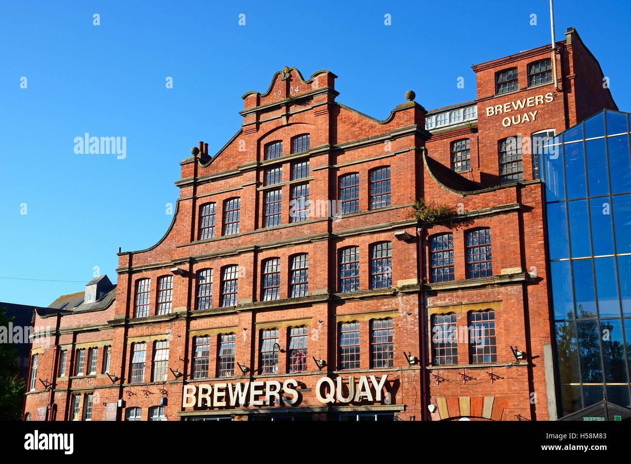 View of the Brewers Quay building in Hope Square in the old harbour area (formerly the Devonish brewery), Weymouth, UK. Stock Photo